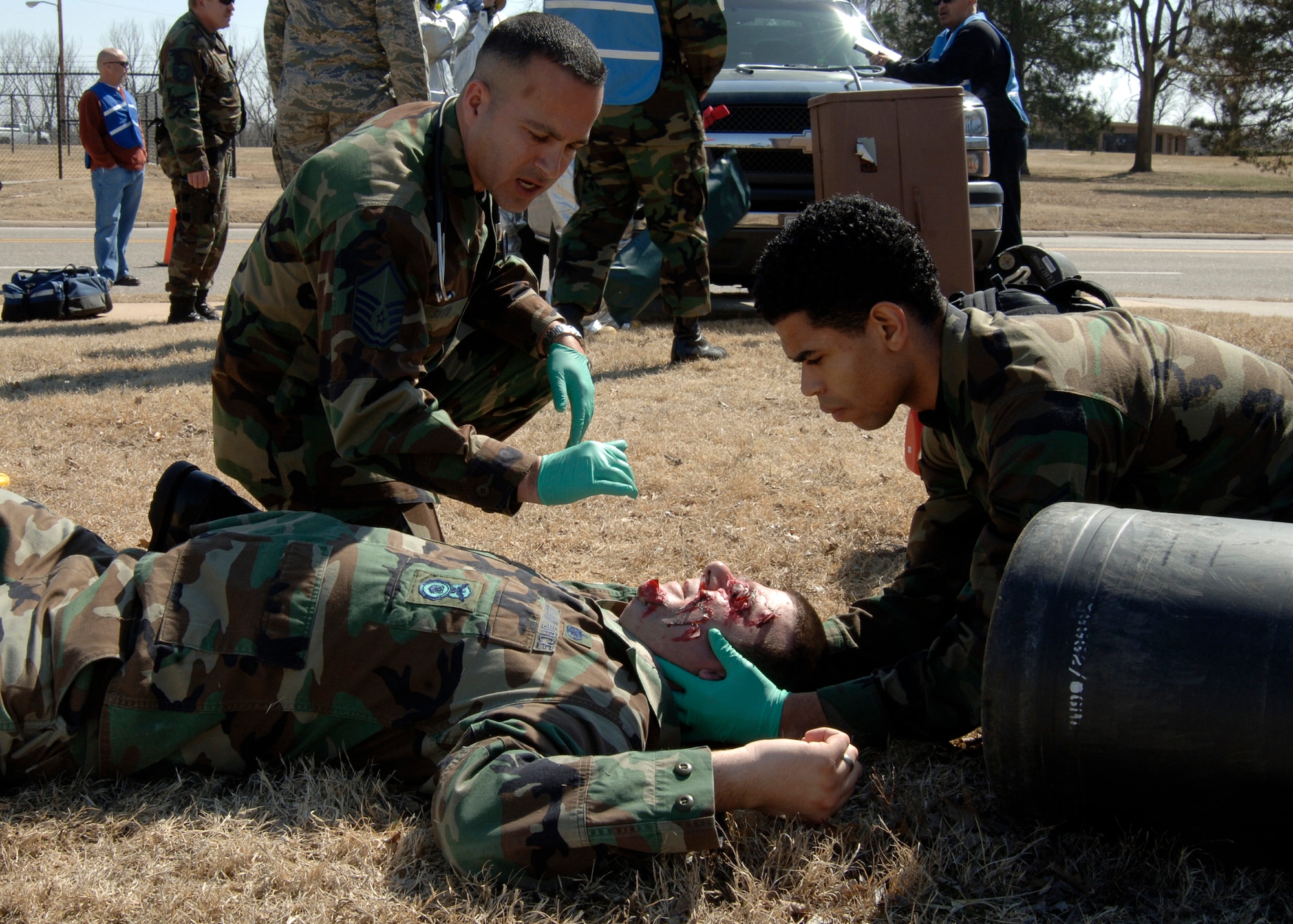 Master Sgt. Christopher Soto and Airman 1st Class Jesus Ramirez stabilize mock injury victim, Master Sgt. Robert Reader, for emergency medical transportation during a tornado response exercise in March 2008. A 2009 exercise, nicknamed "Gray Funnel," is scheduled to begin about 1:30 p.m. Tuesday. Sergeant Reader is the 931st Air Refueling Group's Security Forces chief. Sergeant Soto and Airman Ramirez are assigned to the 22nd Air Refueling Wing, the 931st's active-duty host wing at McConnell Air Force Base, Kan. (U.S. Air Force photo/Airman Justin Shelton) 