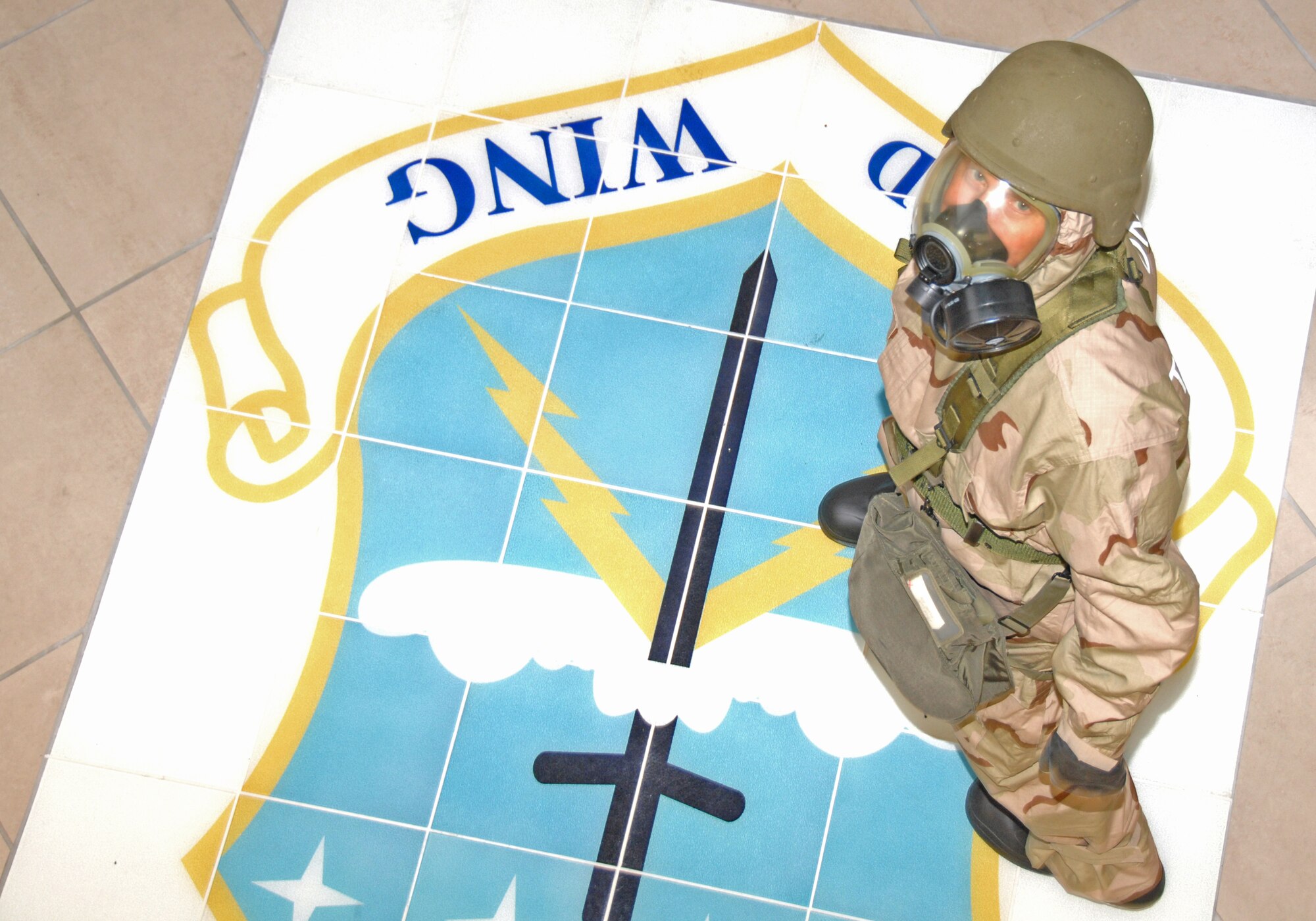 Tech. Sgt. Kirk Martin, 403rd Wing finance office, takes part in a wing exercise simulating how he and his comrades would respond to a chemical attack to the base. It might be three years away, but reservists at the 403rd Wing have already begun preparation for their Unit Compliance Inspections. Newly appointed 403rd Wing Commander Col. James Muscatel, emphasized the philosophy of "steady incremental improvements" as the key to being prepared and developing the confidence to handle anything that comes along in military life.