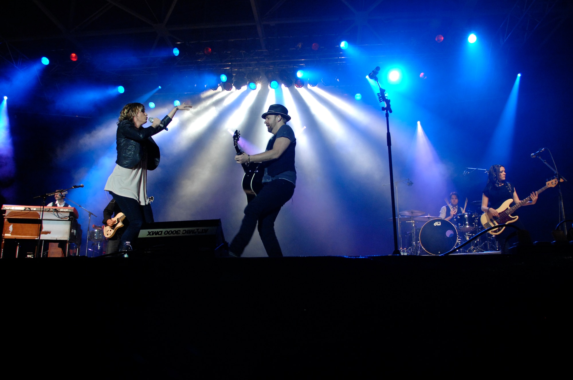 Jennifer Nettles and Kristian Bush of Sugarland entertain about 1,500 Aviano Airmen and civilians March 6 in a hangar on the flighline. Aviano was the first stop on the country music band's first European tour that includes several other military installations in Italy, Germany and the Netherlands. (U.S. Air Force photo/Airman 1st Class Ashley Wood)