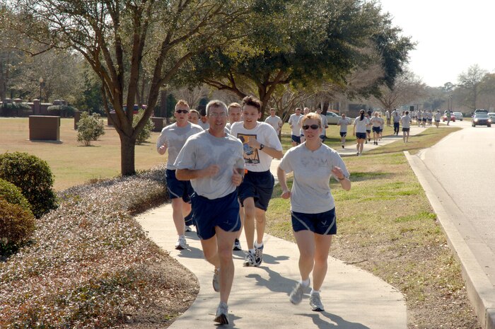 Airmen from Charleston AFB step up their pace as they get closer to the finish line during the Commander's Fitness Challenge here March 6. More than 350 Airmen from various squadrons participated in the 5K run. (U.S. Air Force photo/Staff Sgt. Marie Cassetty)