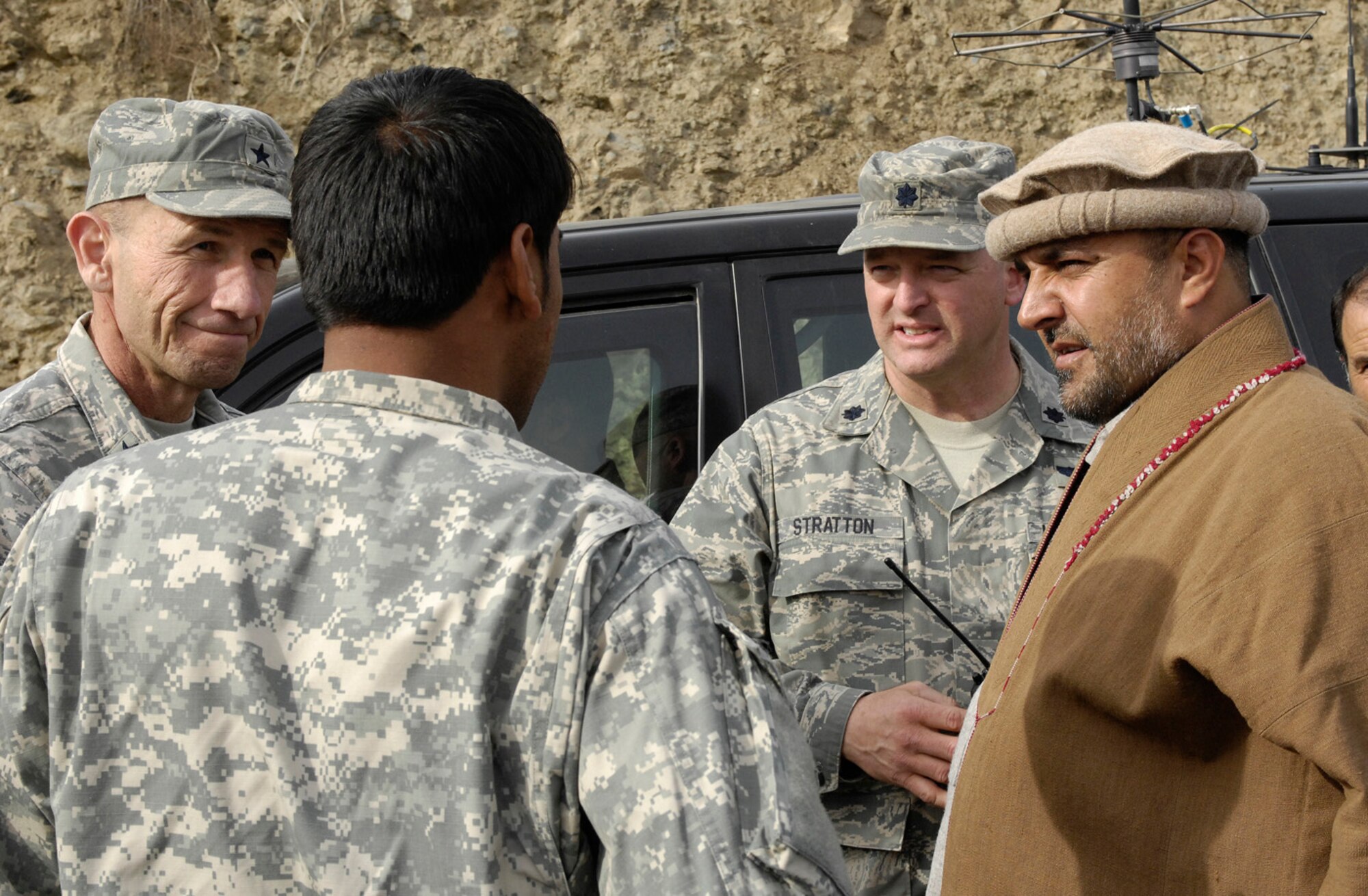 Brig. Gen. Mike Holmes, 455th Air Expeditionary Wing commander, and Lt. Col. Mark Stratton, Panjshir Provincial Reconstruction Team commander, talk with Provincial Governor Haji Bahlol during a visit to the Rokha district March 8. General Holmes, accompanied by Chief Master Sgt. Dennis Vannorsdall, 455th command chief master sergeant, and leadership from the 755th Air Expeditionary Group, came out to Forward Operating Base Lion to talk with Airmen and see what progress has been made in the province Airmen and Soldiers are working to improve. (U.S. Air Force photo by Staff Sgt. Jason Lake)