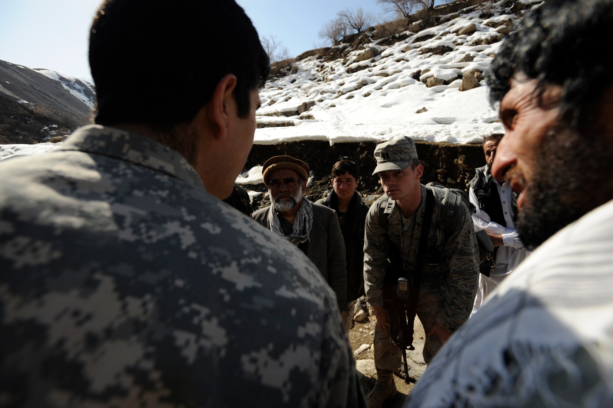 U.S. Air Force Captain Patrick Kolesiak, Panjshir Provincial Reconstruction Team, lead Civil Engineer talks with local villagers about energy issues in Afghanistan Mar. 4, 2009. (U.S. Air Force photo by Staff Sgt. James L. Harper Jr.)