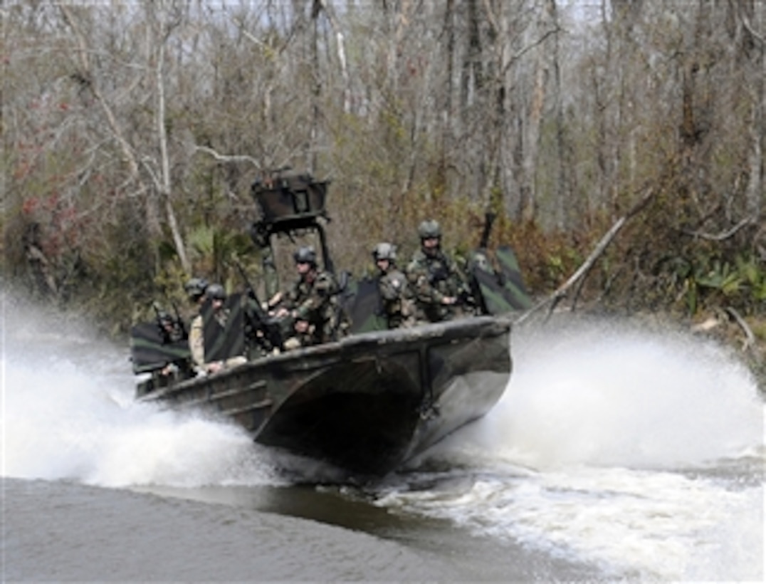 U.S. Navy Special Warfare Combatant-craft crewmen assigned to Special Boat Team 22 conduct live-fire drills on the riverine training range at the John C. Stennis Space Center in Mississippi on March 4, 2009.  Sailors assigned to Special Boat Team 22 operate special operations riverine craft and are assigned to Naval Special Warfare Group 4, the only U.S. special operations command dedicated to operating in riverine environments.  