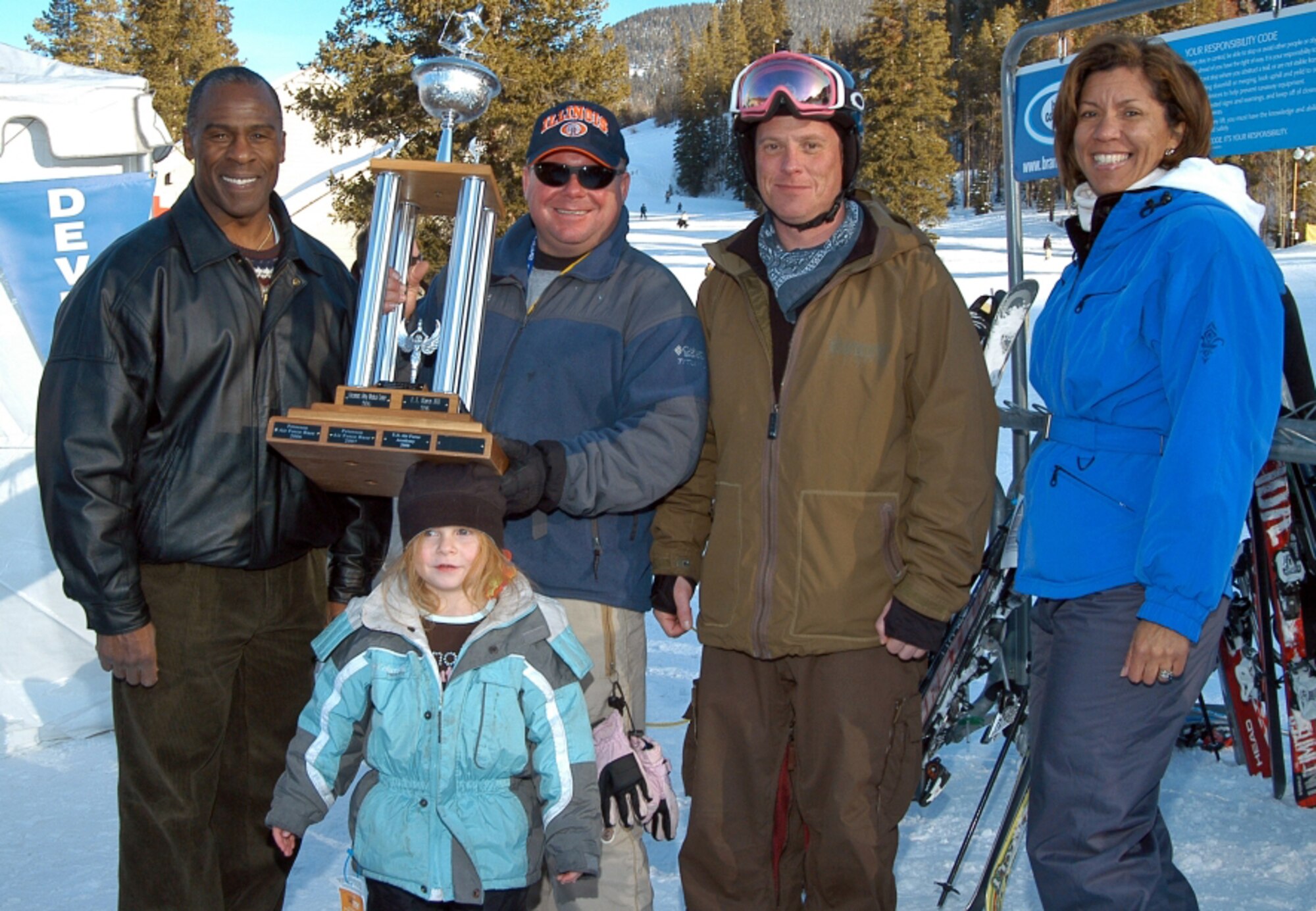 Col. Jimmy McMillian, 10th Air Base Wing commander stands with snowboarder, Maj. John Thomas, Air Force Operational Test and Evaluation Center, Det. 4 and his daughter Abigail; snowboarder Erin O”Connor, retired Air Force, and Col. Emily Buckman, 21st Mission Support Group commander Jan. 30 at SnoFest in Keystone.  Colonels McMillian and Buckman accepted the SnoFest Cup on behalf of Peterson Air Force Base. Peterson AFB won the event with the fastest combined snowboard and ski times. (US Air Force photo by Mr. Warren Schroeder)
