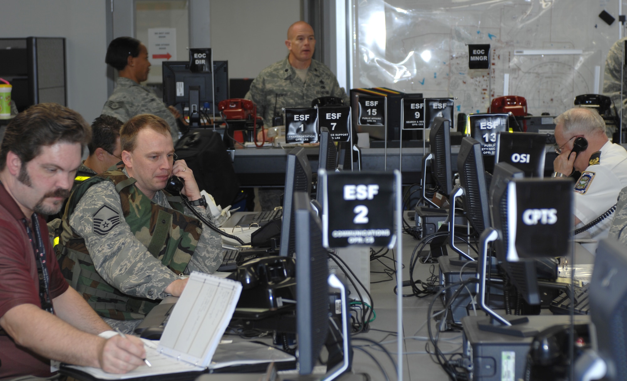 WHITEMAN AIR FORCE BASE, Mo. – Members of the Whiteman Emergency Operations Center coordinate with each other during the Major Accident Response Exercise March 10. The EOC acts as the information hub between base agencies during a major incident response. (U.S. Air Force photo/Capt. Matthew Miller)