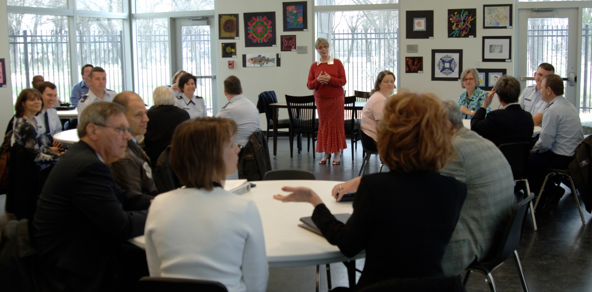 MCCONNELL AIR FORCE BASE, Kan. -- Carol Wohlford, Andover Public Library director, answers questions from a group of Team McConnell representatives during a civic leader luncheon hosted at the library, March, 9. Team McConnell members met with Andover leaders to discuss strengthening their relationships and bolstering ties with the community. (Photo by Senior Airman Laura Suttles)