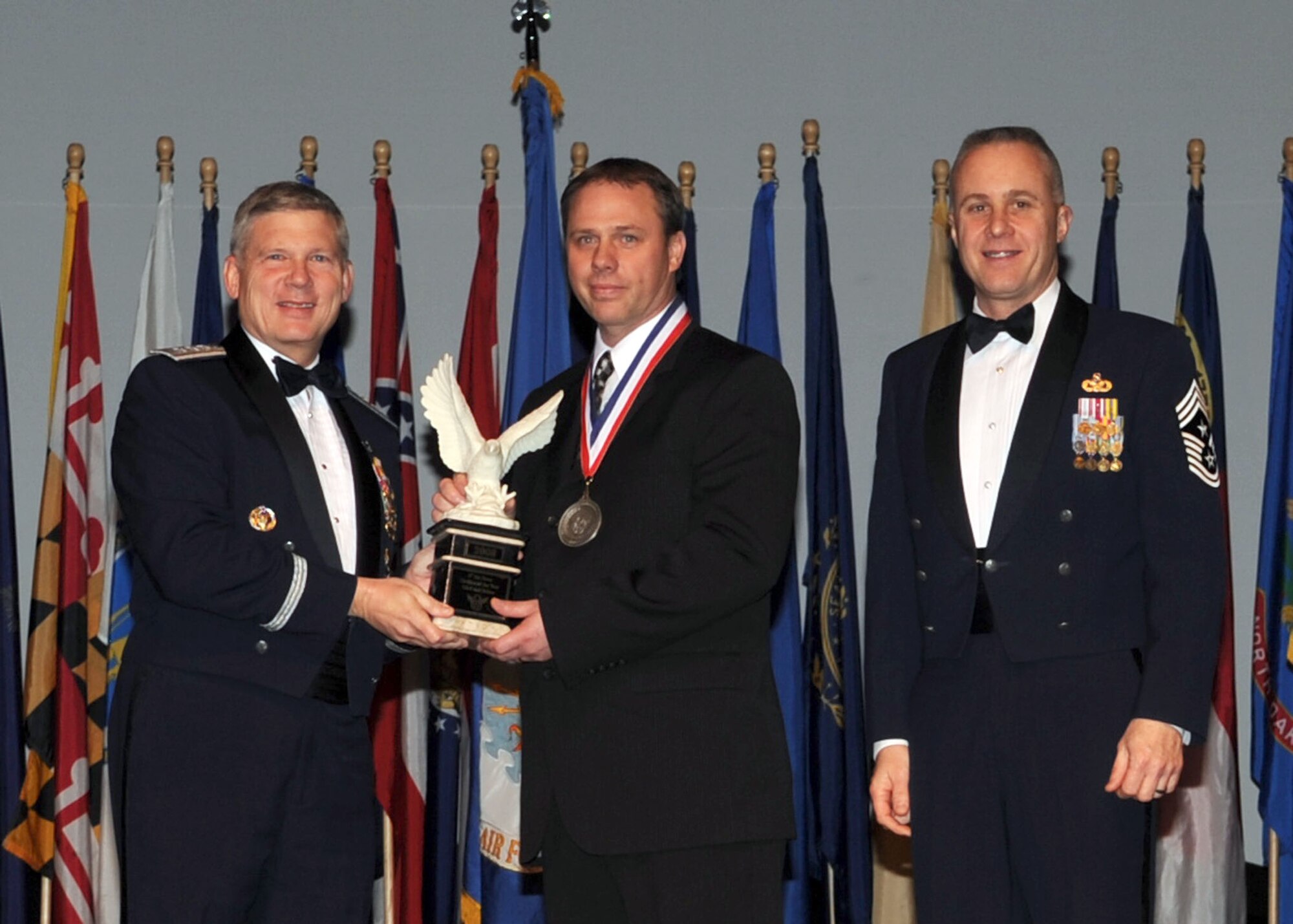 BOSSIER CITY, La. -- Kent Blotter (center), 5th Civil Engineer Squadron, Minot Air Force Base, N.D. wins Civilian of the Year Category One during the Eighth Air Force 2008 Outstanding Airman of the Year Banquet. (U.S. photo by Airman 1st Class Brittany Y. Bateman)
