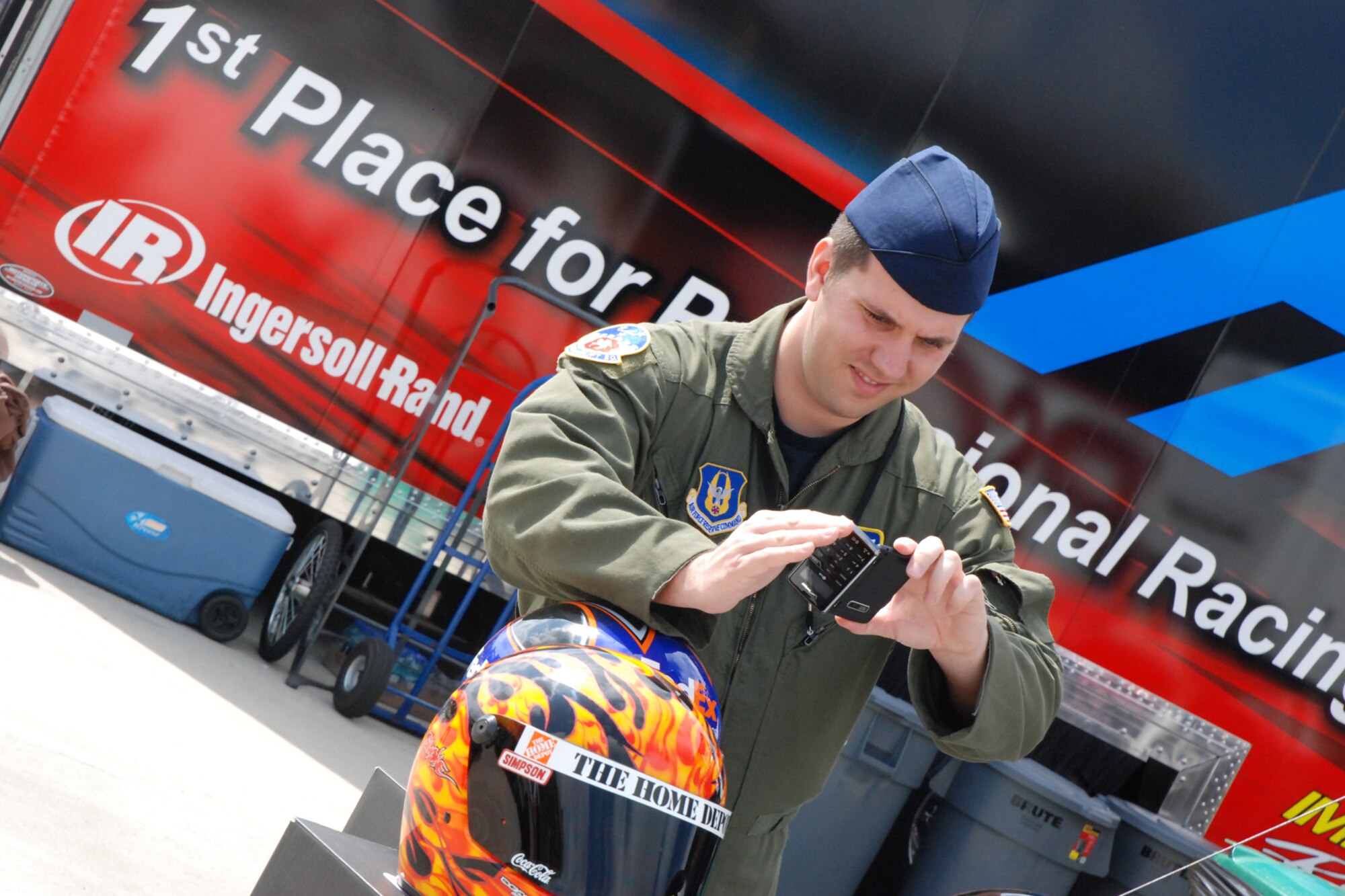 ATLANTA MOTOR SPEEDWAY, Ga. - Tech Sgt. Matt Ripley, 700th Airlift Squadron loadmaster, photographs a NASCAR helmet during his guest-of-honor visit at the American Commercial Lines 200 NASCAR Camping World Truck Series race on March 7. (U.S. Air Force photo/Tech. Sgt. James Branch)