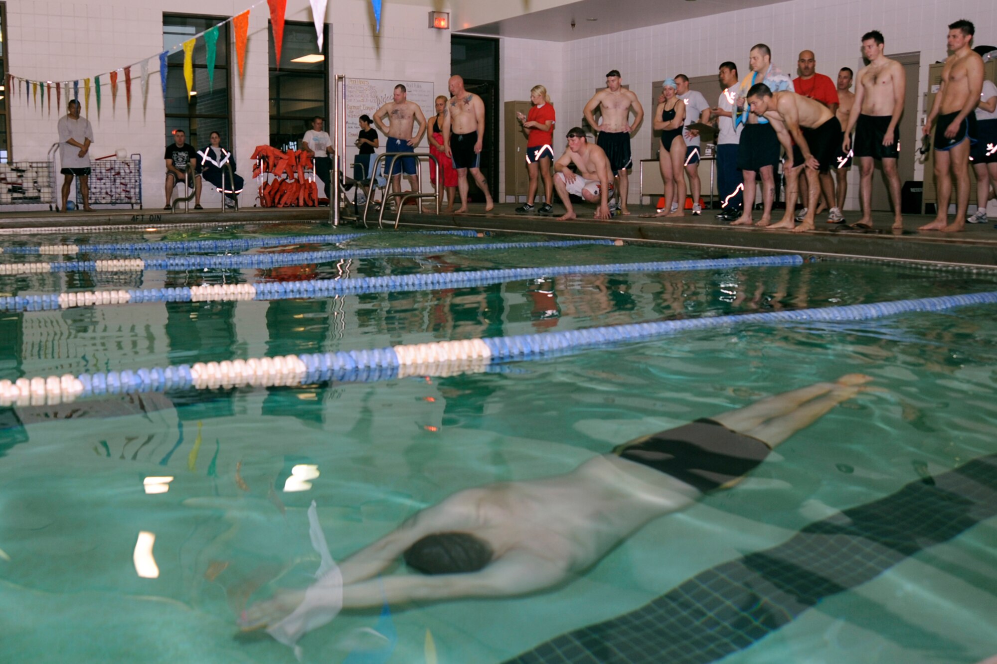 MCCONNELL AIR FORCE BASE, Kan. -- Team McConnell members compete in a swim meet of individual, butterfly, breast-stroke, back-stroke and freestyle relay races during the Air Force Assistant Fund sports day, March 6.  The overall squadron winner for sports day was the 22nd Civil Engineer Squadron and a total of $2,055 was raised. (Photo by Airman 1st Class Maria Ruiz)