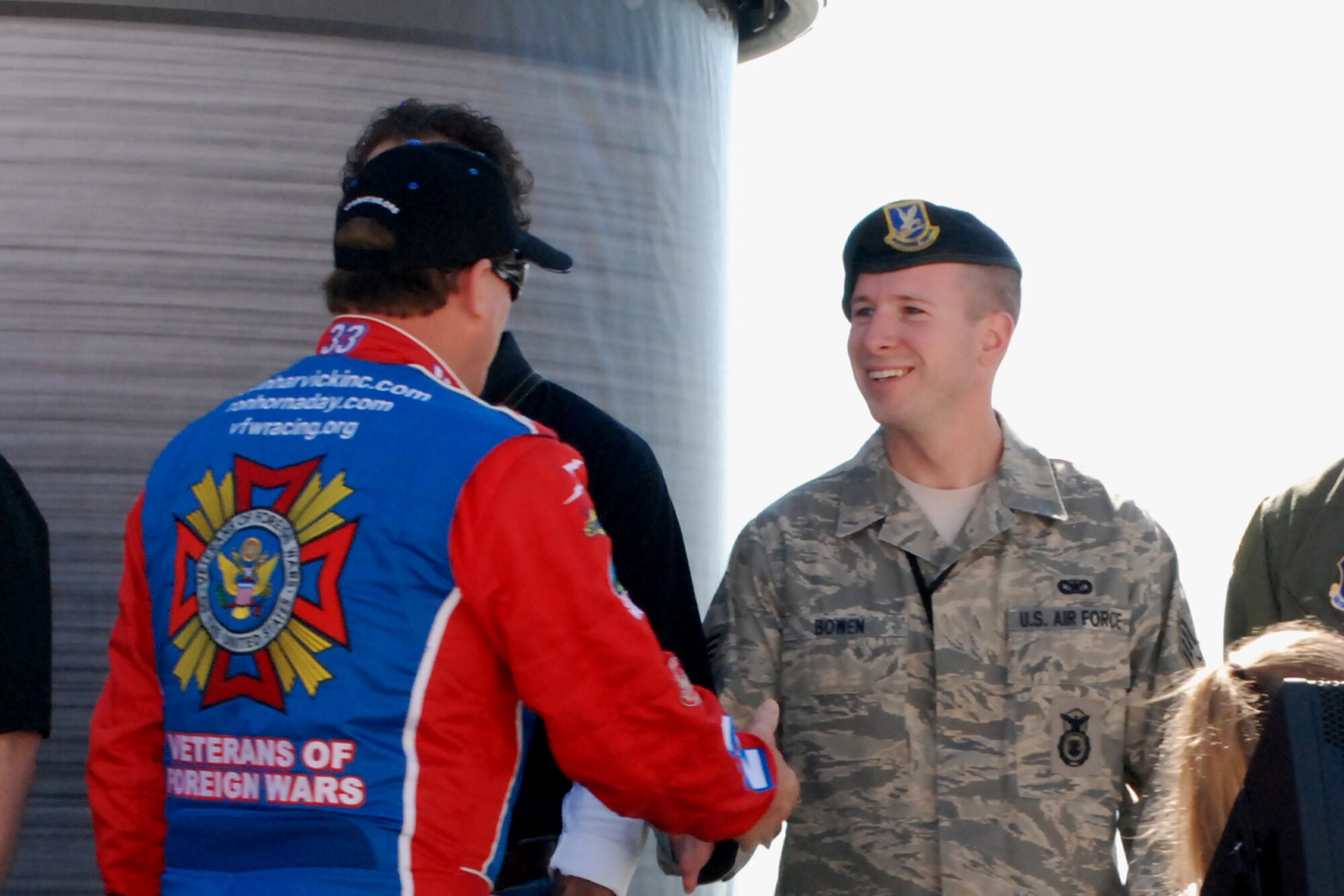 ATLANTA MOTOR SPEEDWAY, GA. - Staff Sgt. Edward Bowen shakes hands with Ron Hornaday, driver of the No. 33 Veterans of Foreign Wars NASCAR truck.  Sergeant Bowen attended Saturday?s race as a guest of the Atlanta Motor Speedway?s ?American Commercial Lines 200 NASCAR Camping World Truck Series race? event on, March 7.  (U.S. Air Force photo/Tech. Sgt. James Branch)
