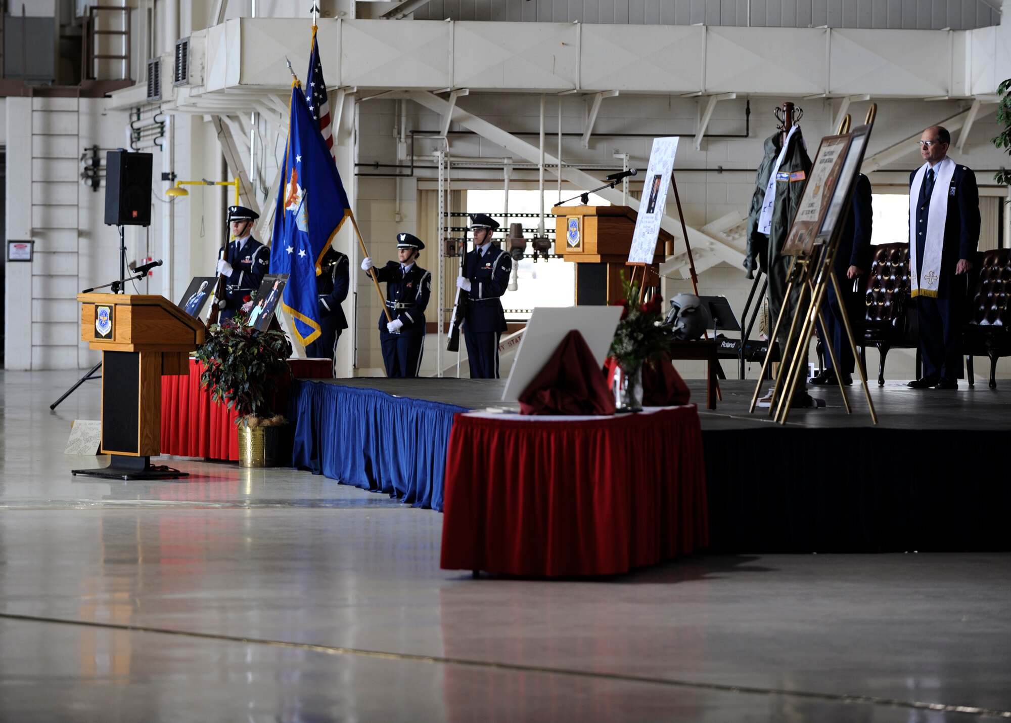 MCCONNELL AIR FORCE BASE, Kan. -- Base Honor Guard members hold the colors during the national anthem at Col. Michael V. Krueger’s memorial service, March 9. Colonel Krueger was remembered by many of his coworkers during the service, who told stories of his effect on their lives. (Photo by Airman Justin Shelton)
