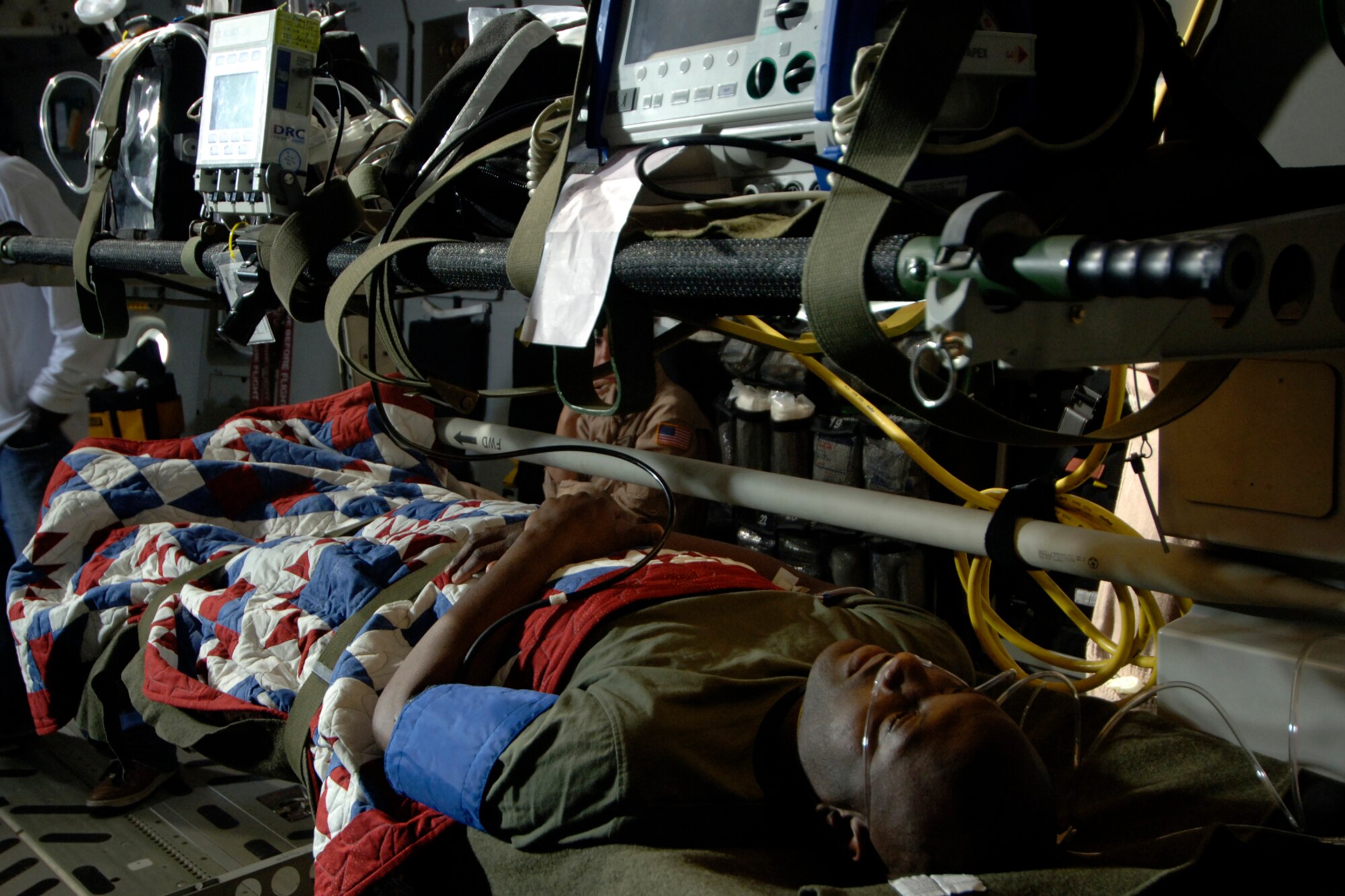 Tech. Sgt. Omeaterance Mewborn lays on a stretcher after being preped for the filming of an Army Wives scene in the back of a C-17 here March 10. Several Team Charleston Airmen were used as extras during the filming. Sergeant Mewborn is with the 437th Maintenance Operations Squadron. (U.S. Air Force photo/Senior Airman Timothy Taylor)
