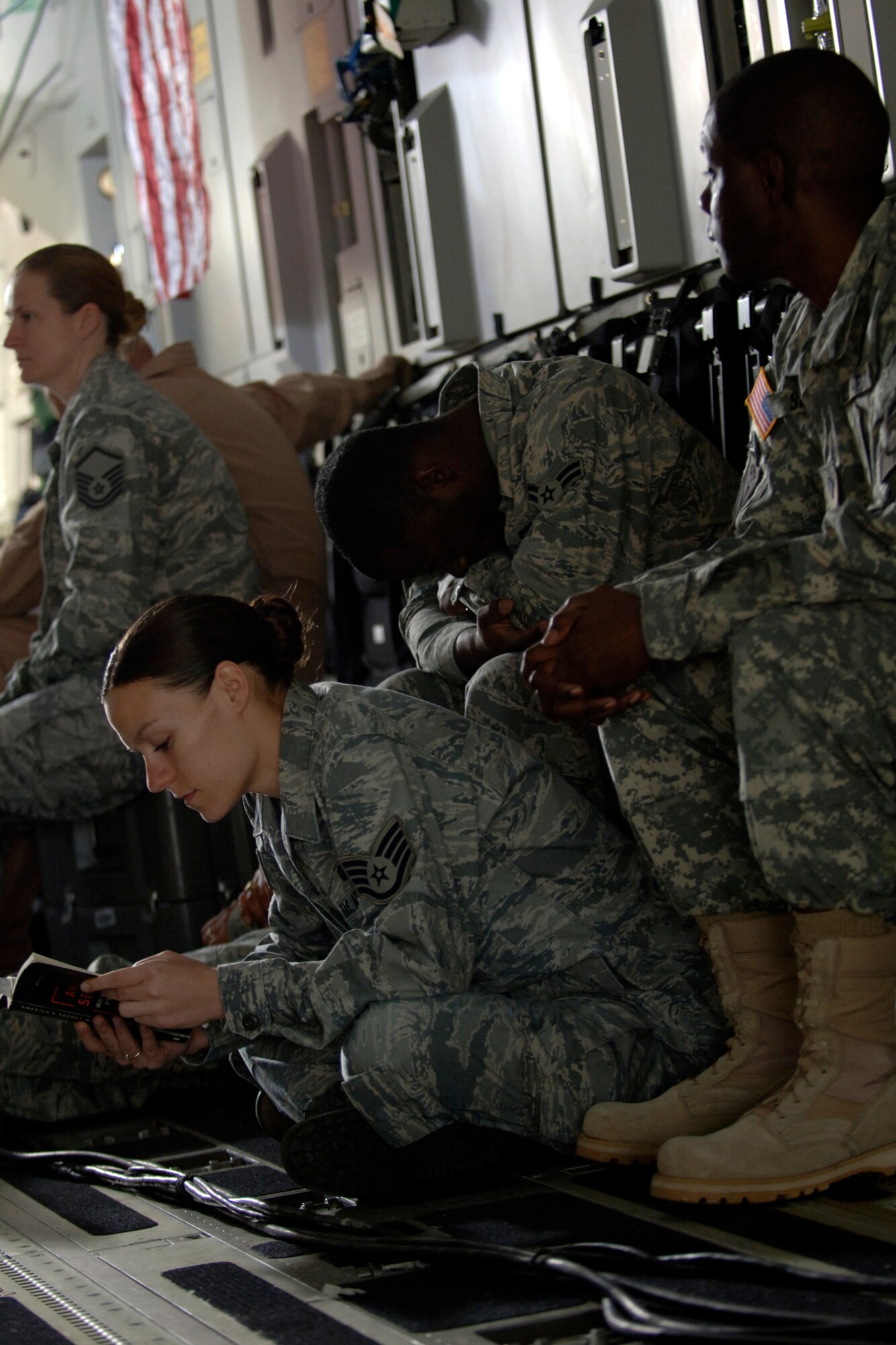 Team Charleston Airmen wait for the Army Wives production crew to begin filming inside a C-17 here March 10. To give the show a more authentic look, the Department of Defense and base leadership has authorized filming at various locations around base. (U.S. Air Force photo/Senior Airman Timothy Taylor)
