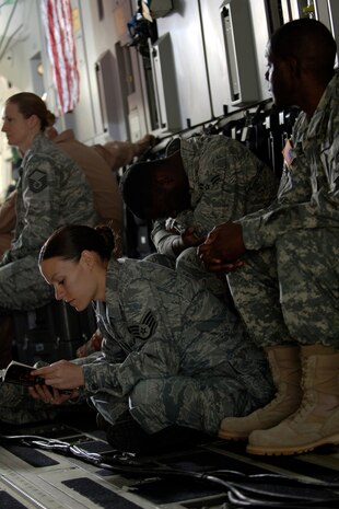 Team Charleston Airmen wait for the Army Wives production crew to begin filming inside a C-17 here March 10. To give the show a more authentic look, the Department of Defense and base leadership has authorized filming at various locations around base. (U.S. Air Force photo/Senior Airman Timothy Taylor)