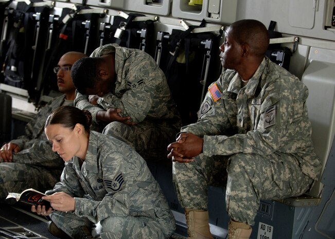 Team Charleston Airmen wait for the Army Wives production crew to begin filming inside a C-17 here March 10. To give the show a more authentic look, the Department of Defense and base leadership has authorized filming at various locations around base. (U.S. Air Force photo/Senior Airman Timothy Taylor)