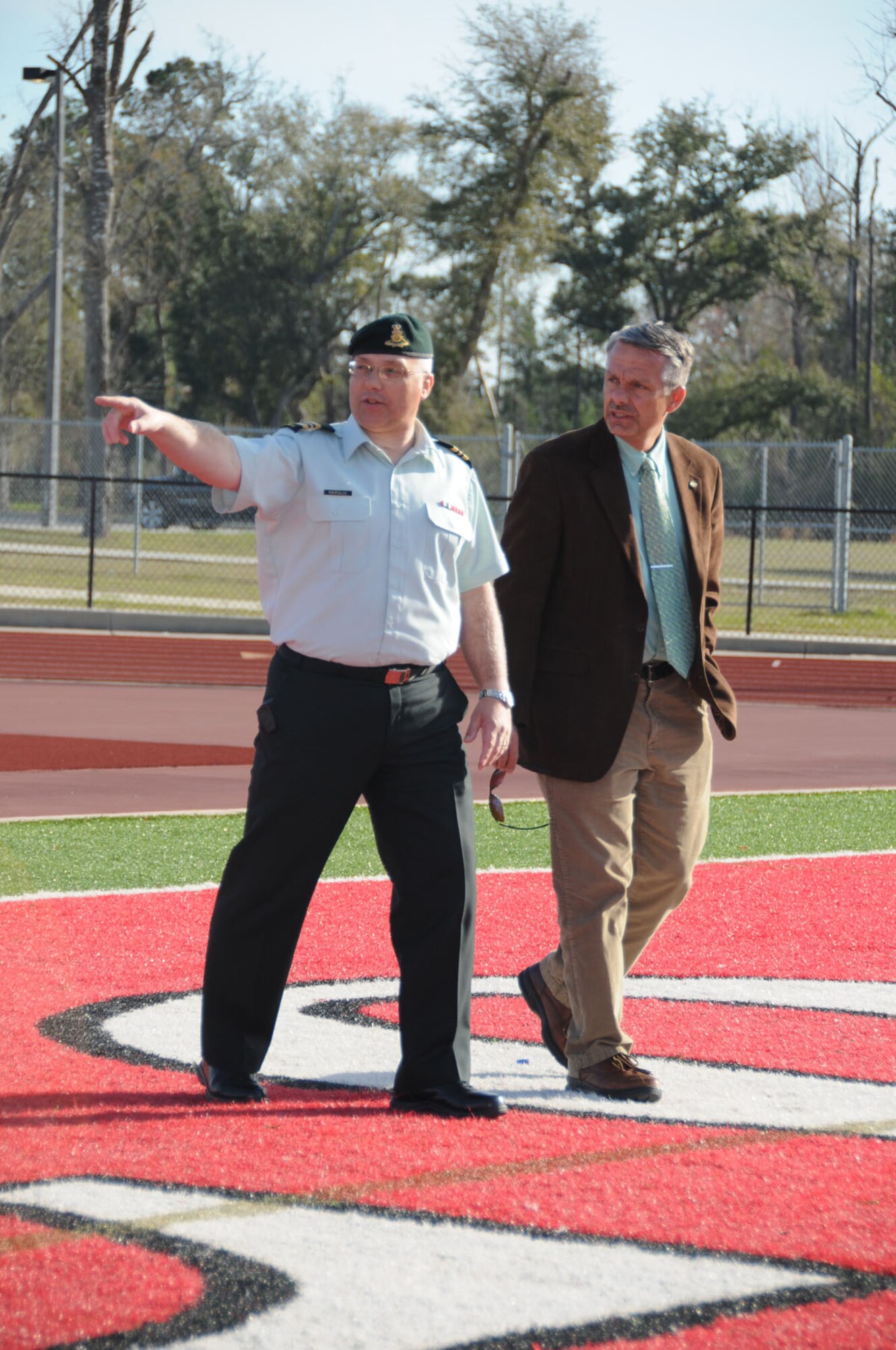 Canadian Army Maj. Steve Kiropoulos, left, acting president of the Conseil International du Sport Militaire soccer technical committee, and Brian Mooers, Keesler’s CISM project officer, tour Biloxi High School athletic facilities March 3.  The school is a venue for CISM’s 10-day women’s soccer tournament hosted by Keesler in June.  (U.S. Air Force photo by Kemberly Groue)
