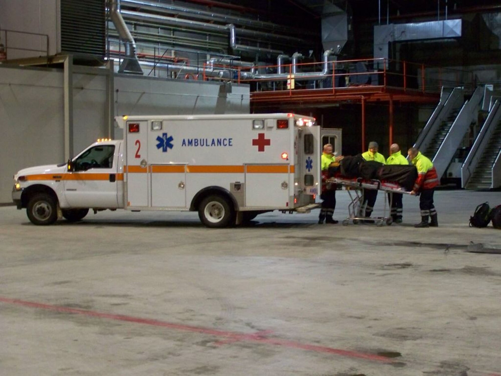 A National Science Foundation employee is loaded onto a ambulance March 7 at about 11:30 p.m. after he was medically evacuated from Station Summit research camp nearly 700 miles away from Thule Air Base, Greenland. The clinic at Thule AB treats anyone who can make it to the clinic, including patients from outlying villages (U.S. Air Force photo/Capt. Ed Jackowski)
