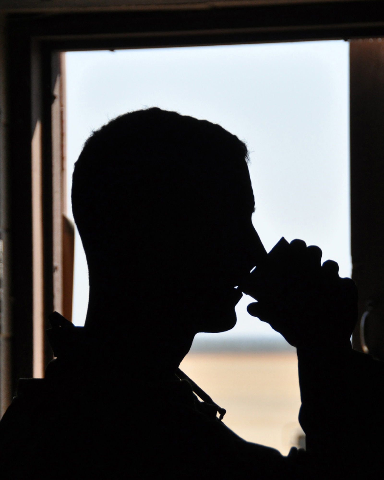 2nd Lt. Ryan Fisher, a logistics officer with the 817th Contingency Response Group, takes a coffee break in the Joint Operations Center during a Joint Forcible Entry Exercise at Fort Bragg, N.C., March 2-8. Following the airfield seizure portion of the exercise, Lieutenant Fisher's aerial port team formed the backbone of a Joint Task Force-Port Opening mission. After off-loading cargo from a C-17 and C-130, the aerial porters set-up an aerial port of debarkation and worked with the Army's 689th Rapid Port Opening Element to move the supplies to a forward distribution node. (U.S. Air Force photo/1st Lt. Dustin Doyle)