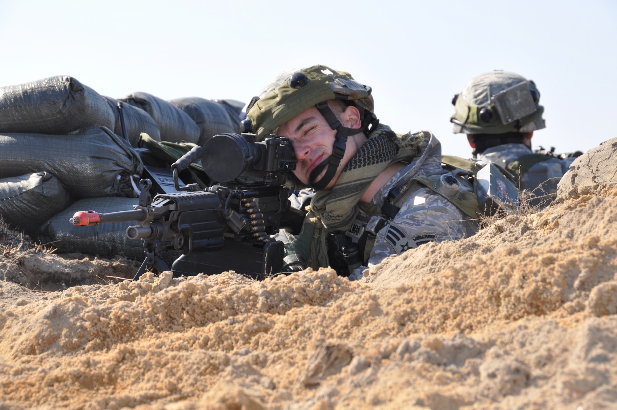 Senior Aiman Travis Fillman, a force protection Airman from the 817th Contingency Response Group, mans a defensive fighting position during a Joint Forcible Entry Exercise at Fort Bragg, N.C., March 2-8. During the exercise, security forces Airmen from the 621st Contingency Response Wing helped the Army provide airfield security following the initial airfield seizure. (U.S. Air Force photo/1st Lt. Dustin Doyle)