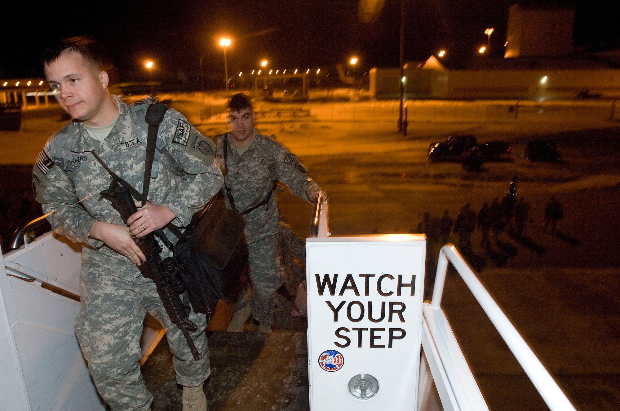 ELMENDORF AIR FORCE BASE, Alaska -- Soldiers from 4th Brigade, 25th Infantry Division (Airborne) board the jet that will take them to Afghanistan March 10, 2009. The 4-25 BDE 25th ID is deploying 3,500 Soldiers to perform counter-terrorism operations, aid with reconstruction, and educate and equip the Afghan national security forces. (U.S. Air Force photo/Senior Airman Jonathan Steffen)