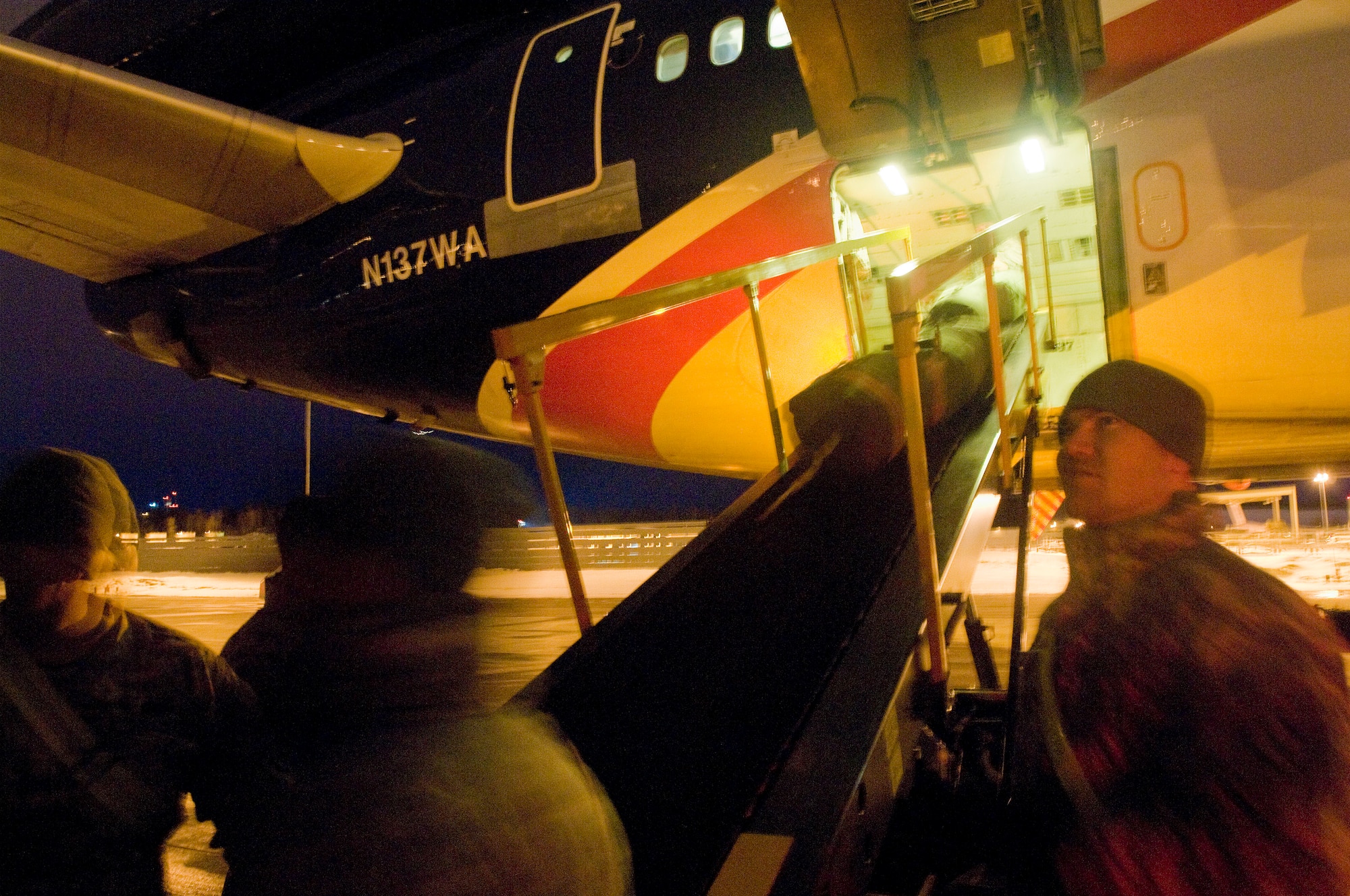 ELMENDORF AIR FORCE BASE, Alaska -- Soldiers from 4th Brigade, 25th Infantry Division (Airborne) loads their packs on to a jet heading to Afghanistan March 10, 2009. The 4th BDE 25th ID is deploying 3,500 Soldiers to perform counter-terrorism operations, aid with reconstruction, and educate and equip the Afghan national security forces. (U.S. Air Force photo/Senior Airman Jonathan Steffen)