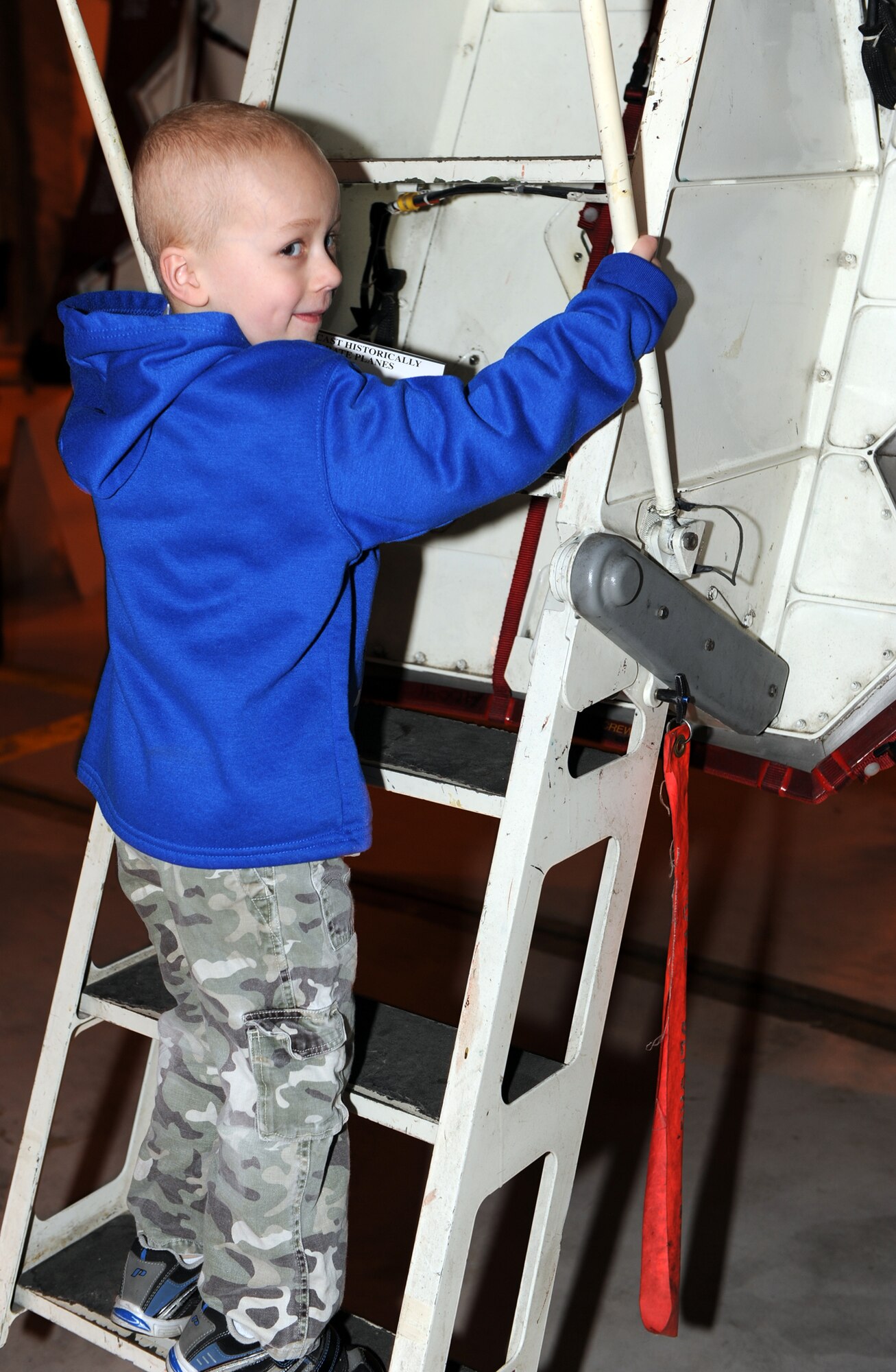 WHITEMAN AIR FORCE BASE, Mo. – Kellen Bolling climbs into the cockpit of the Spirit of Hawaii B-2 bomber Feb. 27. Kellen came to Whiteman with his family to become a pilot for a day Feb. 27. (U.S. Air Force photo/Airman 1st Class Carlin Leslie)
