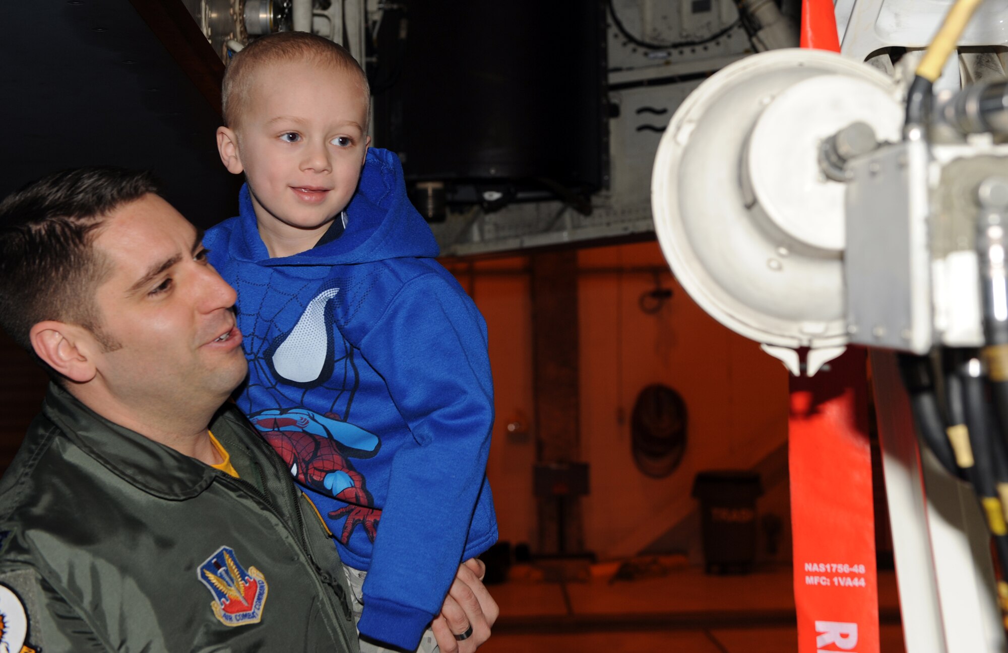 WHITEMAN AIR FORCE BASE, Mo. - Capt. James Ashlock, 393d Bomb Squadron, shows Kellen Bolling the Spirit of Hawaii B-2 bomber Feb. 27. Kellen came to Whiteman with his family to become a pilot for a day Feb. 27. (U.S. Air Force photo/Airman 1st Class Carlin Leslie)