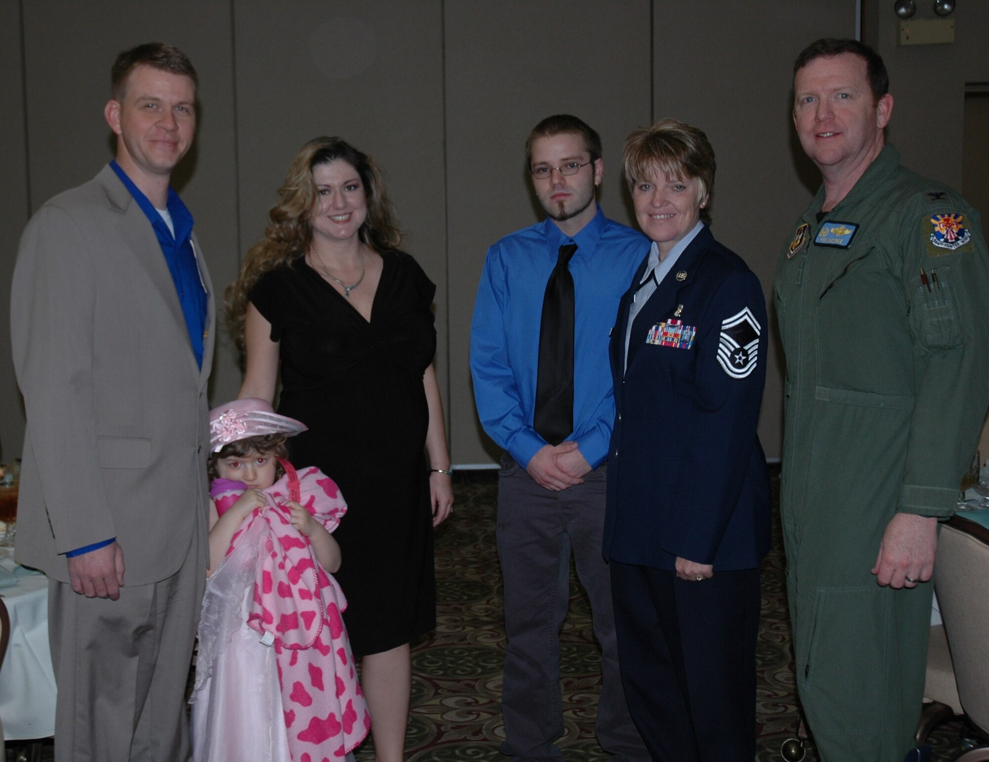 (From left to right) Kelley Williams, Caitlyn Williams, Amy Williams, John Wente, Senior Master Sgt. Cheryl Wente, and Col. Richard Scobee, pose for a photo following the Graydon Williams Award luncheon Feb. 18.  Kelley Williams, son of the late Tech. Sgt. Graydon Williams, was a special guest during this year's luncheon.  The award is presented annually to an Air Reserve Technician or Active Guard Reserve member who personifies the character and traits of the late Tech. Sgt. Graydon Williams, a 944th Maintenance Group member who died at a young age of cancer.  The essence of the award is based on superior performers who do not seek recognition, perform clearly above expectations, and have not been adequately recognized for their overall contributions and impact on the wing.  (U.S. Air Force photo/Tech. Sgt. Susan Stout)