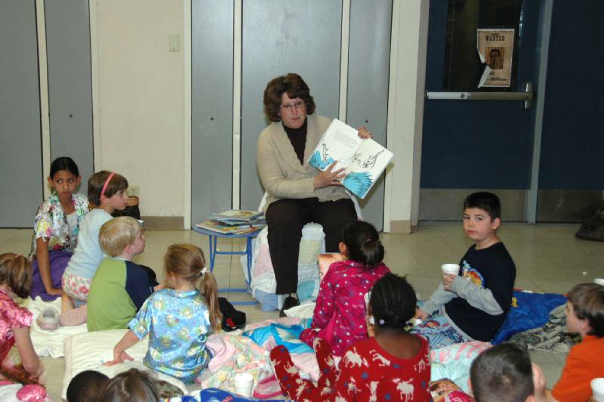 Anita Eichhorn, wife of Maj. Gen. David Eichhorn, reads to students during Branch Elementary School's "Get Wild About Reading" story night  March 5. More than 270 students, parents and visitors participated in the event hosted by the Branch Parents and Teachers Organization. (Courtesy photo)