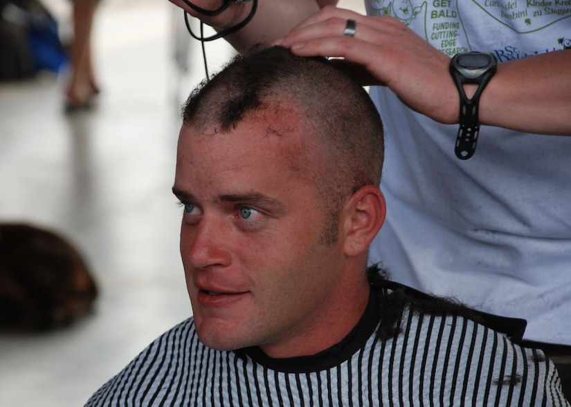 SOTO CANO AIR BASE, Honduras -- Senior Airman David Thomas, Soto Cano firefighter, gets his head shaved to raise money for children's cancer research through the St. Baldrick's Foundation.  The Soto Cano Fire Department raised more than $2,500 by holding a head-shaving event here March 6.  Spnsored by family and friends, volunteers went bald in solidarity with kids who typically lose their hair during cancer treatment.  (U.S. Air Force photo/Tech. Sgt. Rebecca Danét)
 
