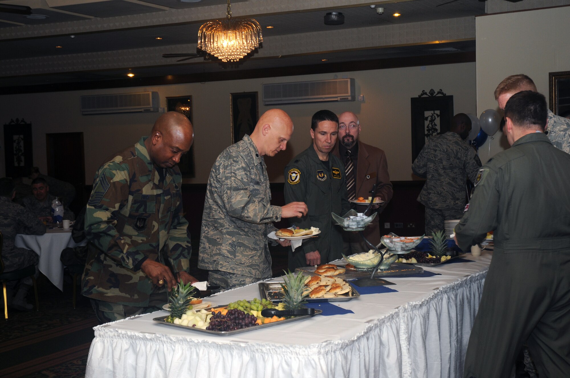 Attendees of the Air Force Assistance Fund campaign kick-off gather around a breakfast buffet March 10, 2009 at RAF Lakenheath. England. The AFAF campaign is an annual campaign to raise money for Air Force charities such as the Air Force Aid Society, Inc., the General and Mrs. Curtis E. LeMay Foundation, and the Air Force Enlisted Village, Inc. This year’s campaign will run from March 10 to April 21. (U.S. Air Force photo by Senior Airman Kristopher Levasseur)