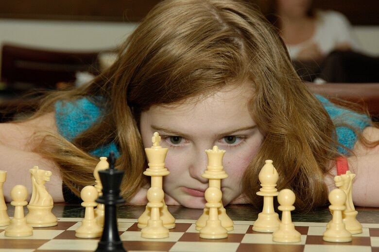 HANSCOM AIR FORCE BASE, Mass. – Lindsey Stutz ponders her next move during the Services sponsored Chess Tournament at the Minuteman Club on March 7. Twenty five chess players took part in the competition. First place winners in their respective categories were: Active Duty, Capt. Alan Hale; Civilian, Greg Lang; Ages 13-18, Rich Chroruiak; Ages 6-12, Leo Sanchez. (U.S. Air Force photo by Linda LaBonte Britt) 