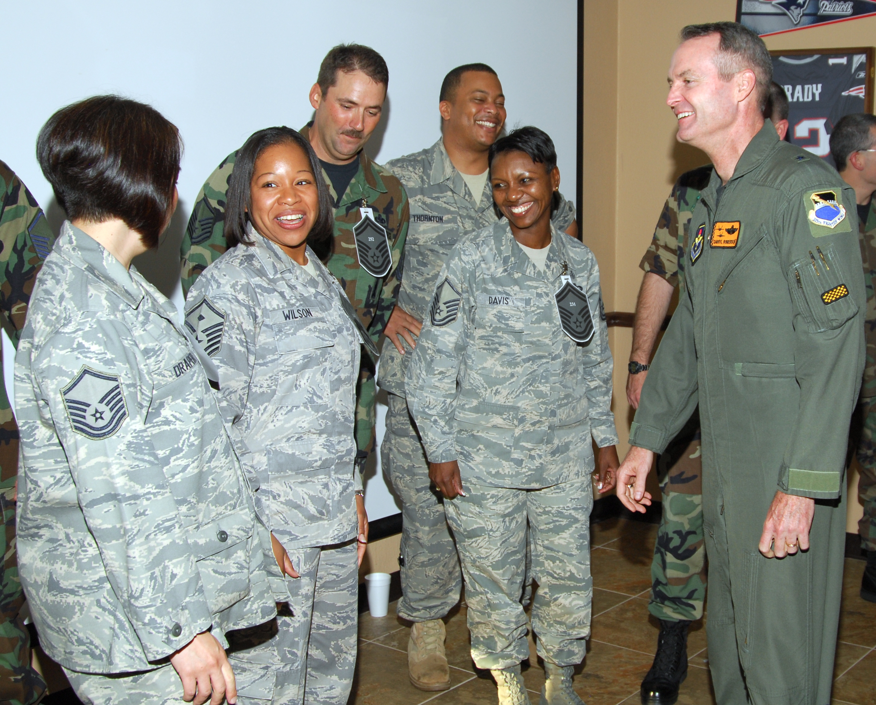 Brig. Gen. Darryl Roberson, 325th Fighter Wing commander, congratulates Tyndall Air Force Base’s new senior master sergeant selects during a promotion ceremony March 6 at the Community Activity Center.  (U.S. Air Force photo by Lisa Norman)