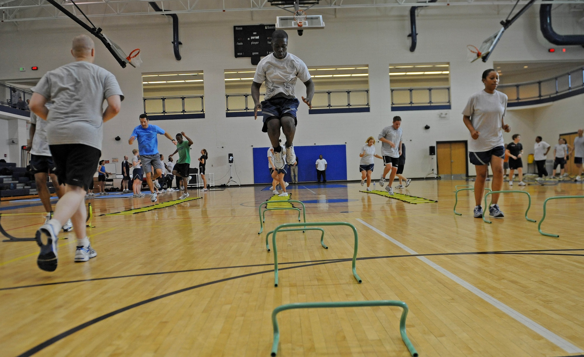 LANGLEY AIR FORCE BASE, Va. -- Langley Airmen jump hurdles during a Velocity Sports Performance workout at the Shellbank Fitness Center March 10. Performance coaches held the workshop to teach Airmen new innovative training methods for building their physical fitness. (U.S. Air Force photo/Airman Rebecca Montez)
