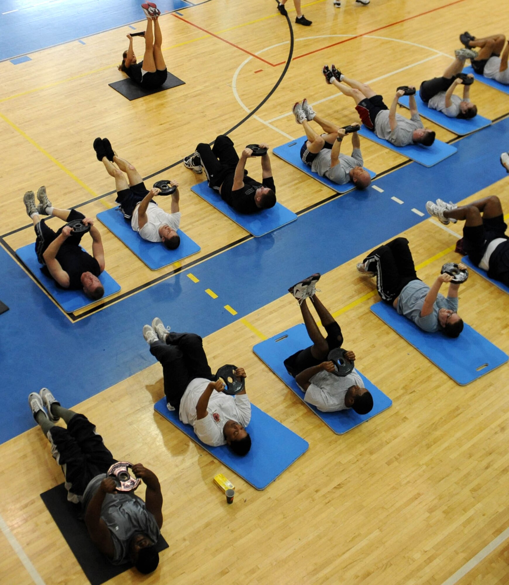 LANGLEY AIR FORCE BASE, Va. -- Langley Airmen participate in a Velocity Sports Performance core exercise at the Shellbank Fitness Center March 10. Performance coaches held the workshop to teach Airmen new innovative training methods for building their physical fitness. (U.S. Air Force photo/Airman Rebecca Montez)