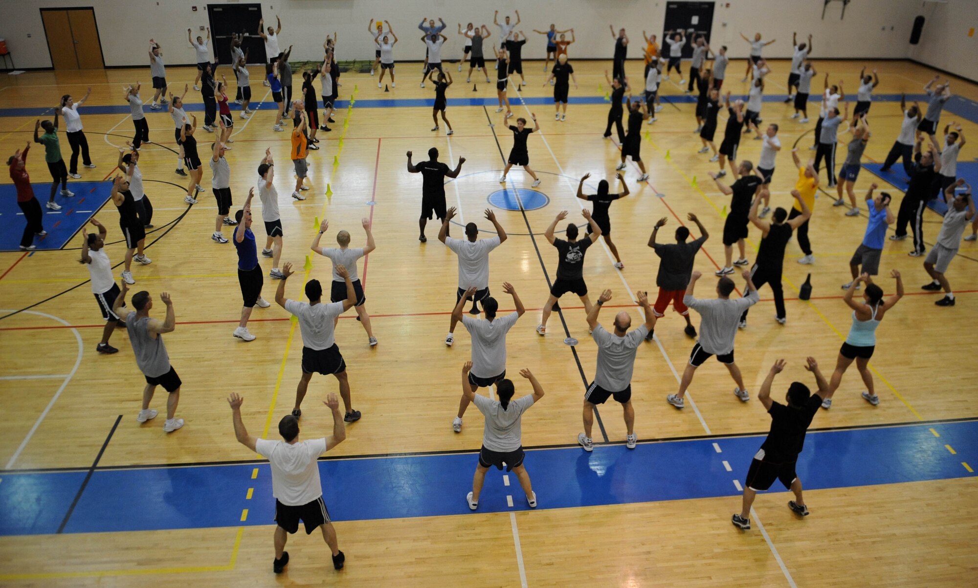 LANGLEY AIR FORCE BASE, Va. -- Langley Airmen participate in a Velocity Sports Performance warm up exercise at the Shellbank Fitness Center March 10. Performance coaches held the workshop to teach Airmen new innovative training methods for building their physical fitness. (U.S. Air Force photo/Airman Rebecca Montez)