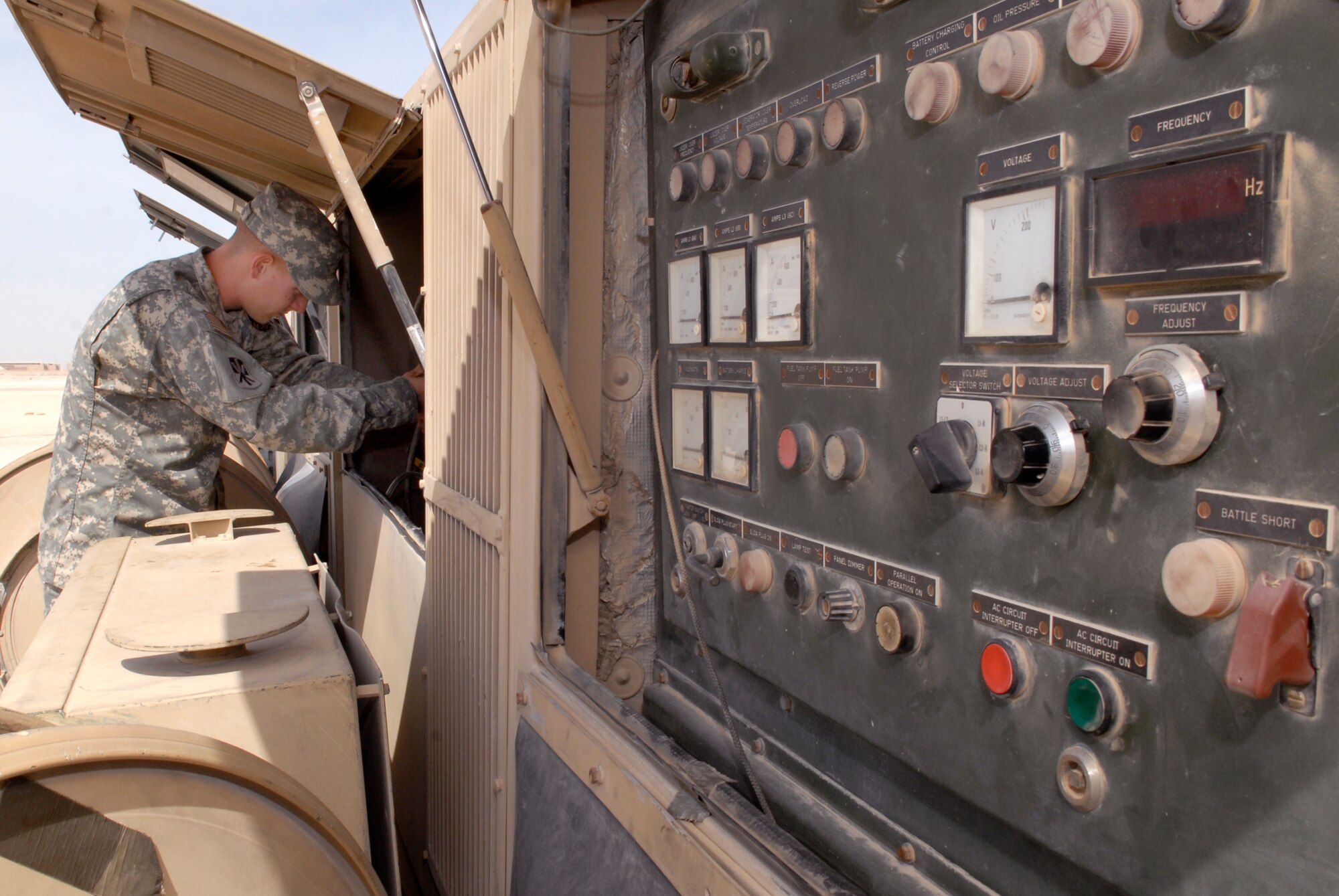 U.S. Army Spc. Justin Bayliss, Alpha 2-43 Air Defense Artillery Battalion Technician, changes an oil filter for an electrical power plant vehicle during routine maintenance, Mar. 10, 2009, at an undisclosed location in Southwest Asia.  Specialist Bayliss hails from Cleveland, Okla. and is deployed from Fort Bliss, Texas in support of Operations Iraqi and Enduring Freedom and Combined Joint Task Force - Horn of Africa.  (U.S. Air Force Photo by Senior Airman Andrew Satran/Released)