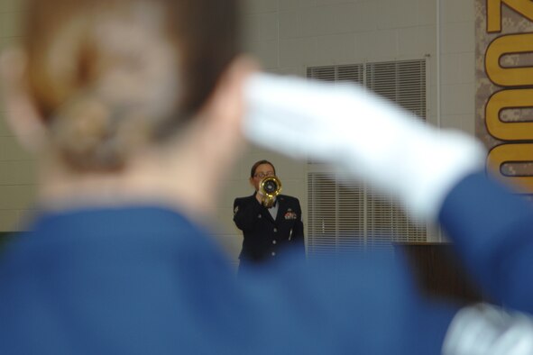 GRISSOM AIR RESERVE BASE, Ind., -- Staff Sgt. Kelly Ehrsam, 122nd Fighter Wing, Fort Wayne Air National Guard, plays Taps as part of a funeral detail during an honor guard graduation ceremony held recently. Members of the 434th ARW were joined by members of the Air National Guard and Army Reserve to receive honor guard training. (U.S. Air Force photo/Tech. Sgt. Doug Hays)