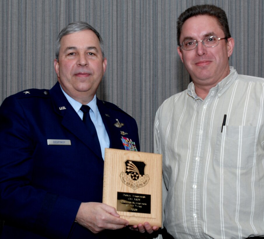 GRISSOM AIR RESERVE BASE, Ind., -- Brig. Gen. Dean Despinoy, 434th Air Refueling Wing commander, left, presents a plaque to Dan Harshman, 434th Communications Squadron, for his selection as Grissom's Civilian Supervisor of the Year for 2008.  The presentation was made during a civilian commander's call held recently. (U.S. Air Force photo/Tech. Sgt. Doug Hays)