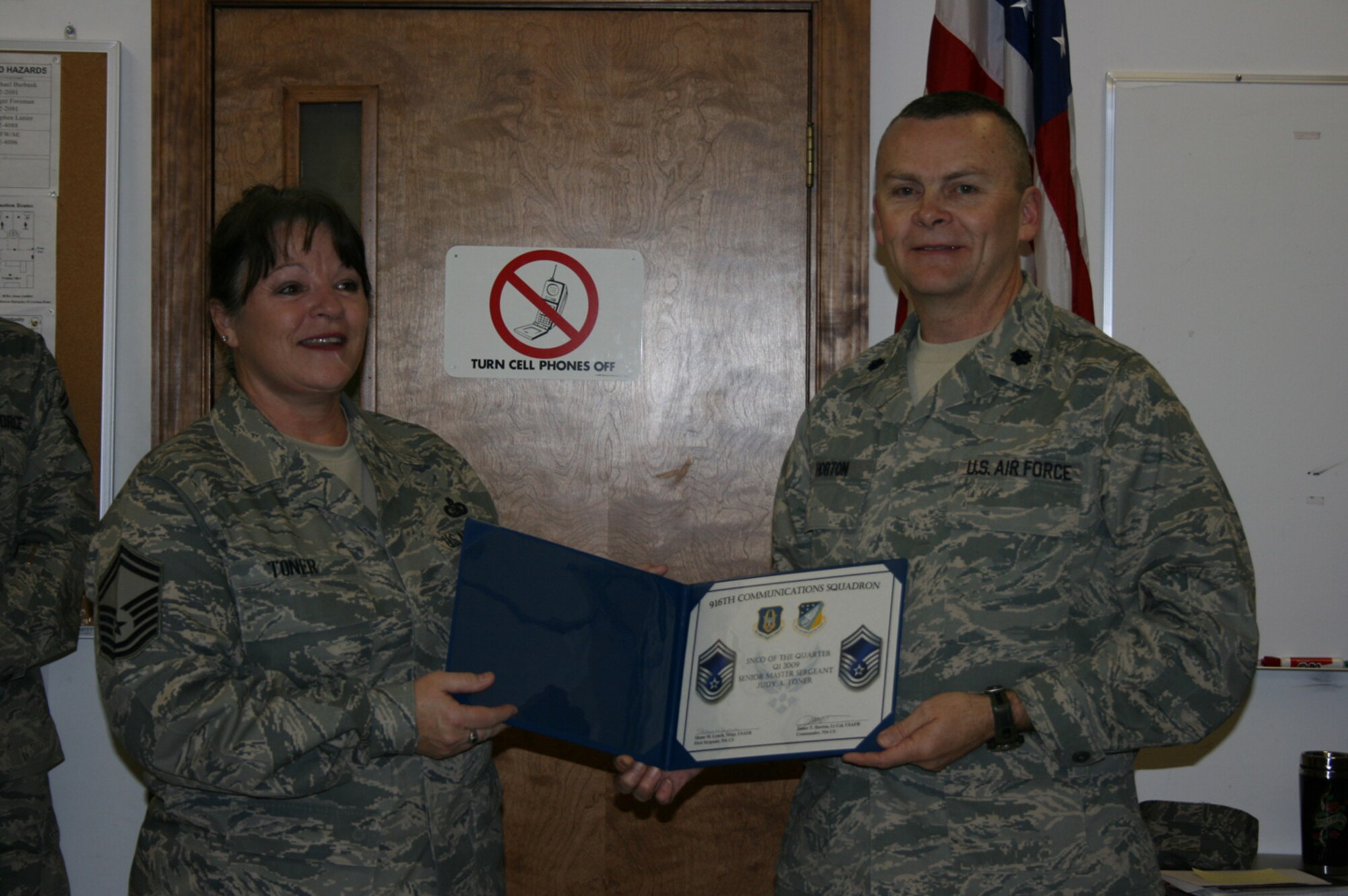 SEYMOUR JOHNSON AIR FORCE BASE, N.C. -- Lt. Col. James Horton (right), commander of the 916th Communication Squadron, presents the 916th Communication Squadron Senior Non-commissioned Officer of the Year award to Senior Master Sgt. Judy Toner.
