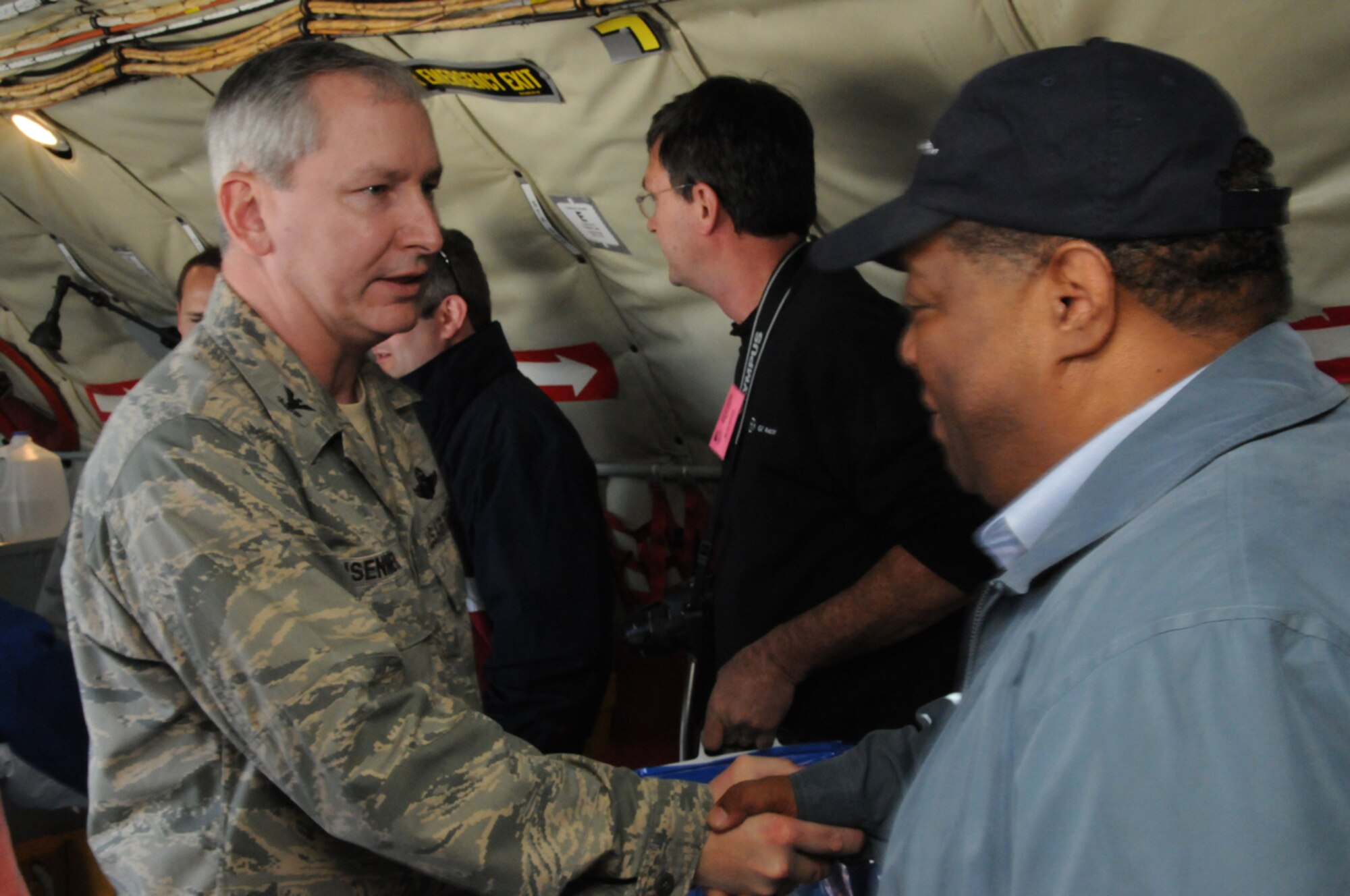 SEYMOUR JOHNSON AIR FORCE BASE, N.C. -- Col. Fritz Linsenmeyer (left), wing commander of the 916th Air Refueling Wing, welcomes a North Carolina employer back from a KC-135 air-to-air refueling mission. More than 30 employers took part in the Reserve wing's bi-annual Employer Day in which they get to fly on a tanker mission, learn about the Reserve mission and see their employees at their Reserve jobs.