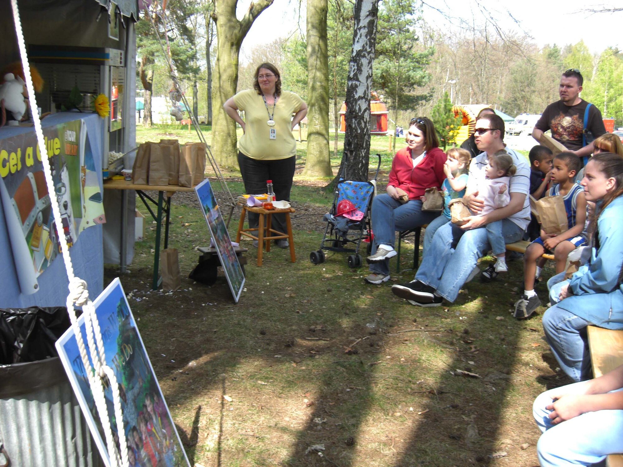 Children and parents watch the U.S. Army Libraries' puppet show at the U.S. Army Garrison Kaiserslautern's Month of the Military Child Celebration April 26 at Pulaski Park on Pulaski Barracks. Photo by Belynda Smith, USAG Kaiserslautern. 