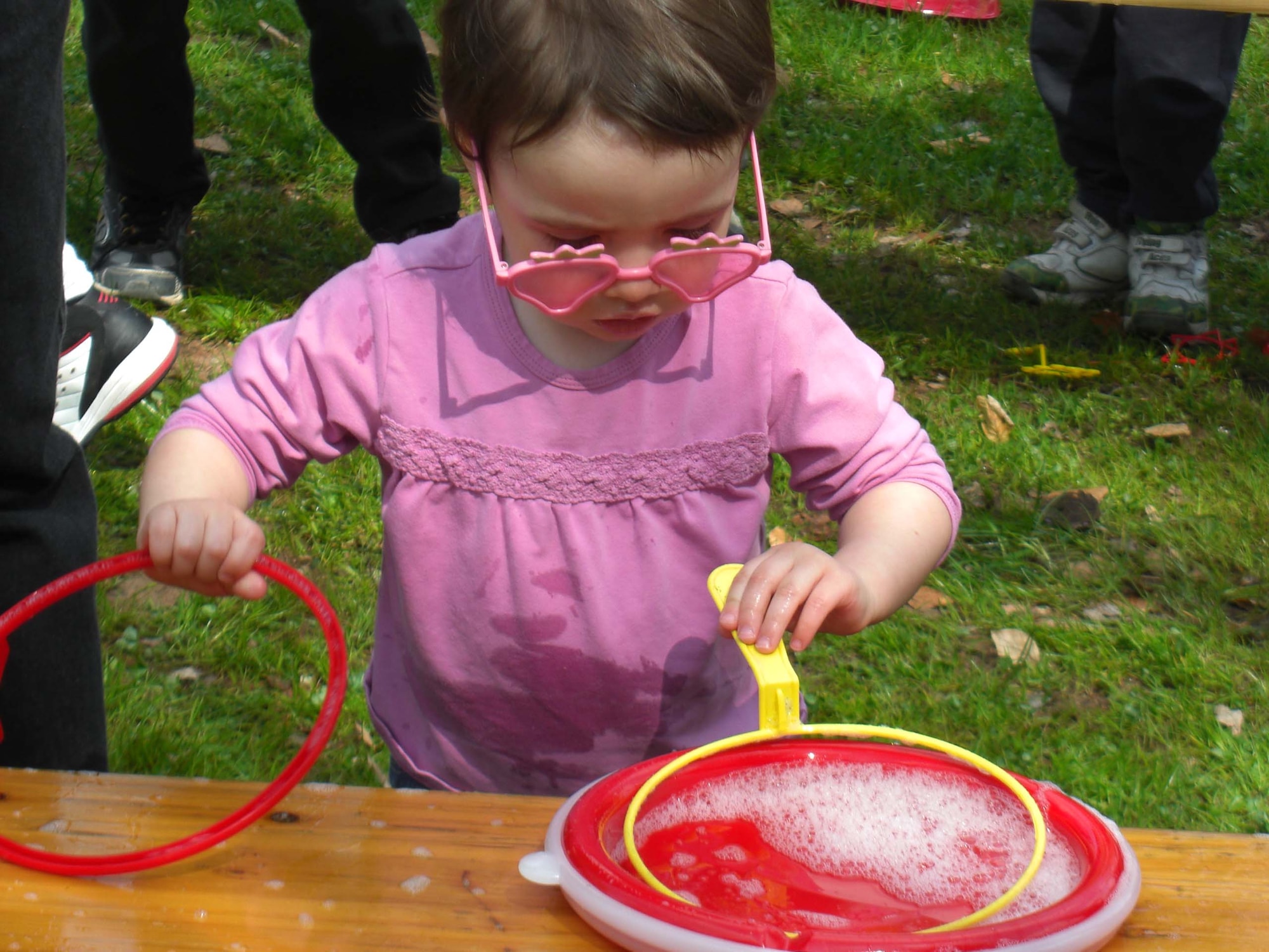 A child plays with bubbles at the U.S. Army Garrison Kaiserslautern's Month of the Military Child Celebration April 26 at Pulaski Park on Pulaski Barracks. Close to 600 parents and children attended the event. (U.S. Army photo by Belynda Smith)