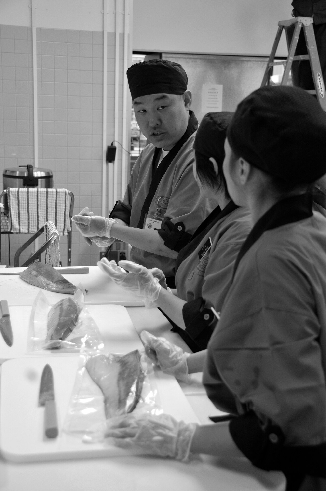 MISAWA AIR BASE, Japan -- Scott Eum, from the Yongsan Commissary, instructs new Misawa Commissary employees on how to create sushi March 10, 2009. Mr. Eum traveled all the way from South Korea to help with the training. (U.S. Air Force photo by Senior Airman Chad Strohmeyer)