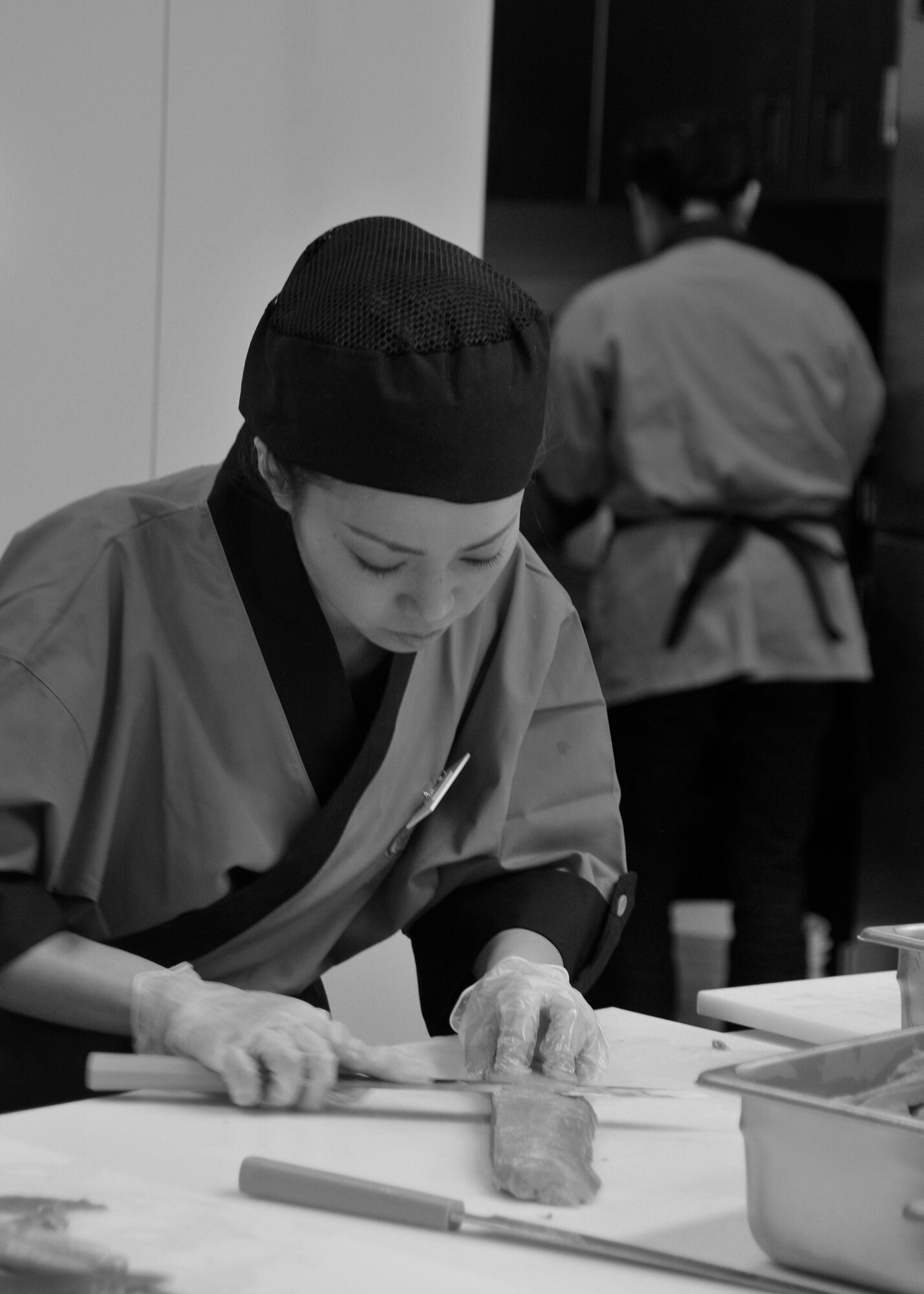 MISAWA AIR BASE, Japan -- Hiroko Ingram, Misawa Commissary employee, cuts salmon during sushi training March 10, 2009.  The Misawa Commissary is scheduled to open a sushi bar March 14, 2009. (U.S. Air Force photo by Senior Airman Chad Strohmeyer)