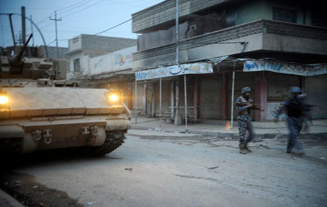 U.S. soldiers from the 8th Regiment, 1st Cavalry Division, and Iraqi National policemen conduct a clearing and census operation in the Zinjali neighborhood of Mosul, Iraq, March 1, 2009.