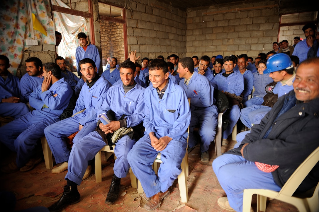 Iraqi men cram into a classroom for training at a Civil Service Corps site in Nimrud, Iraq, March 5, 2009. The corps is an Iraqi-funded effort for an "on the job" training program to provide military-aged males trade skills that will provide employment opportunities and will give the community services not readily available.