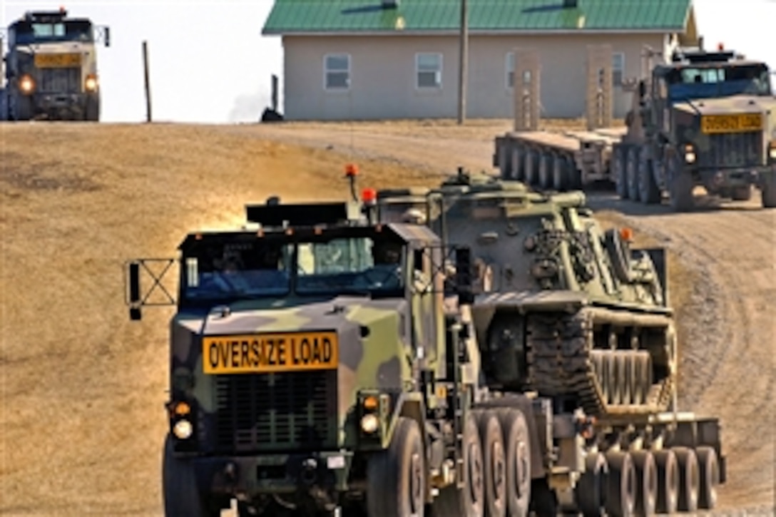 U.S. Army soldiers conduct convoy training as they drive through the Driver’s Familiarization Course on Camp Atterbury, Ind., March 2, 2009. The soldiers are assigned to the 443rd Transportation Company, an Army Reserve unit headquartered in Nebraska.