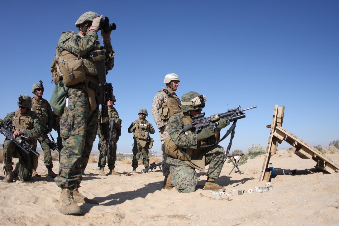 Lance Cpl. Zach Givens, a designated marksman and possible fire team leader with Company E, 2nd Battalion, 7th Marine Regiment, aims and prepares to fire a M203 grenade launcher training round down range during a Tactical Small Unit Leaders Course on Range 105A aboard the Combat Center March 10 through March 19.  TSULC focuses on training team leaders with every weapon system they will use on patrols in a combat environment.