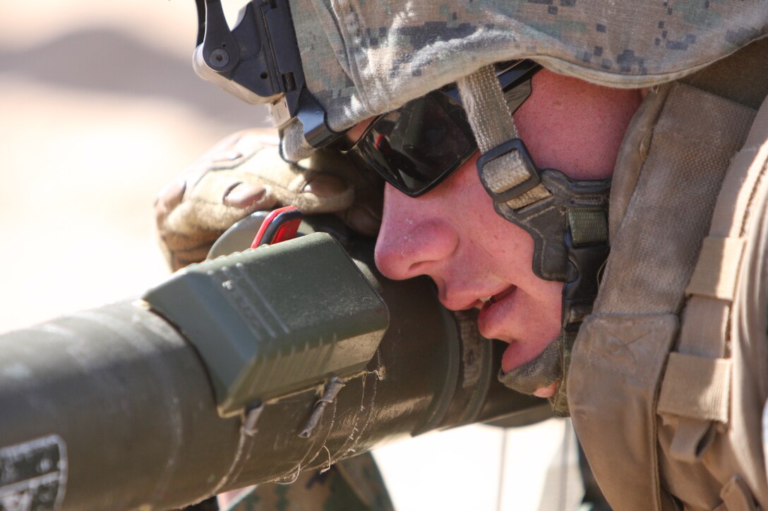 Cpl. Nick Romano, a fire team leader with Company E, 2nd Battalion, 7th Marine Regiment, practices the prone position for firing the AT4 anti-armor weapon during a Tactical Small Unit Leaders Course on Range 105A aboard the Combat Center March 10 through March 19.  The AT4 is so powerful it can take out a light skinned vehicle or immobilize a tank.